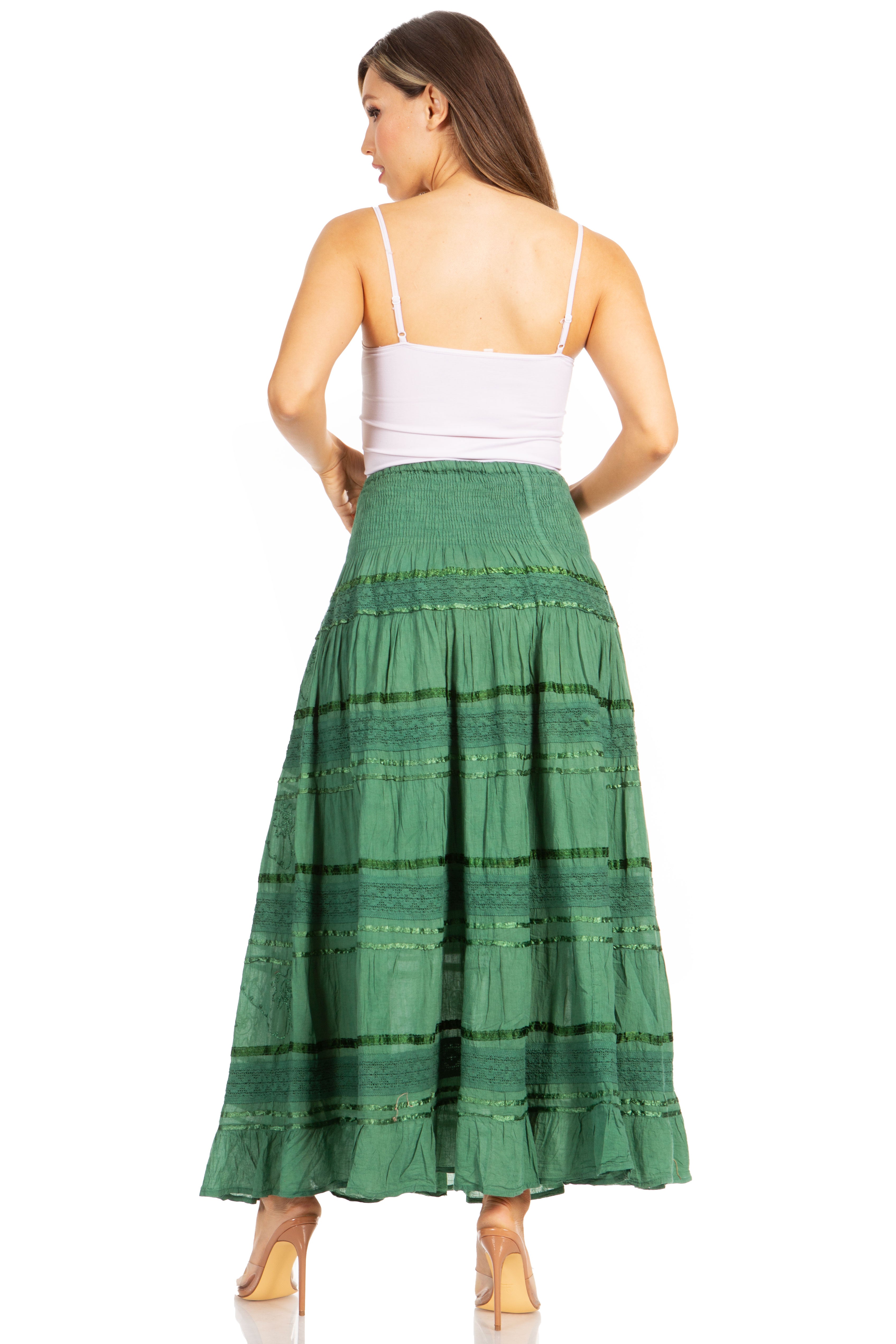 Woman wearing a green tiered skirt on a white background
