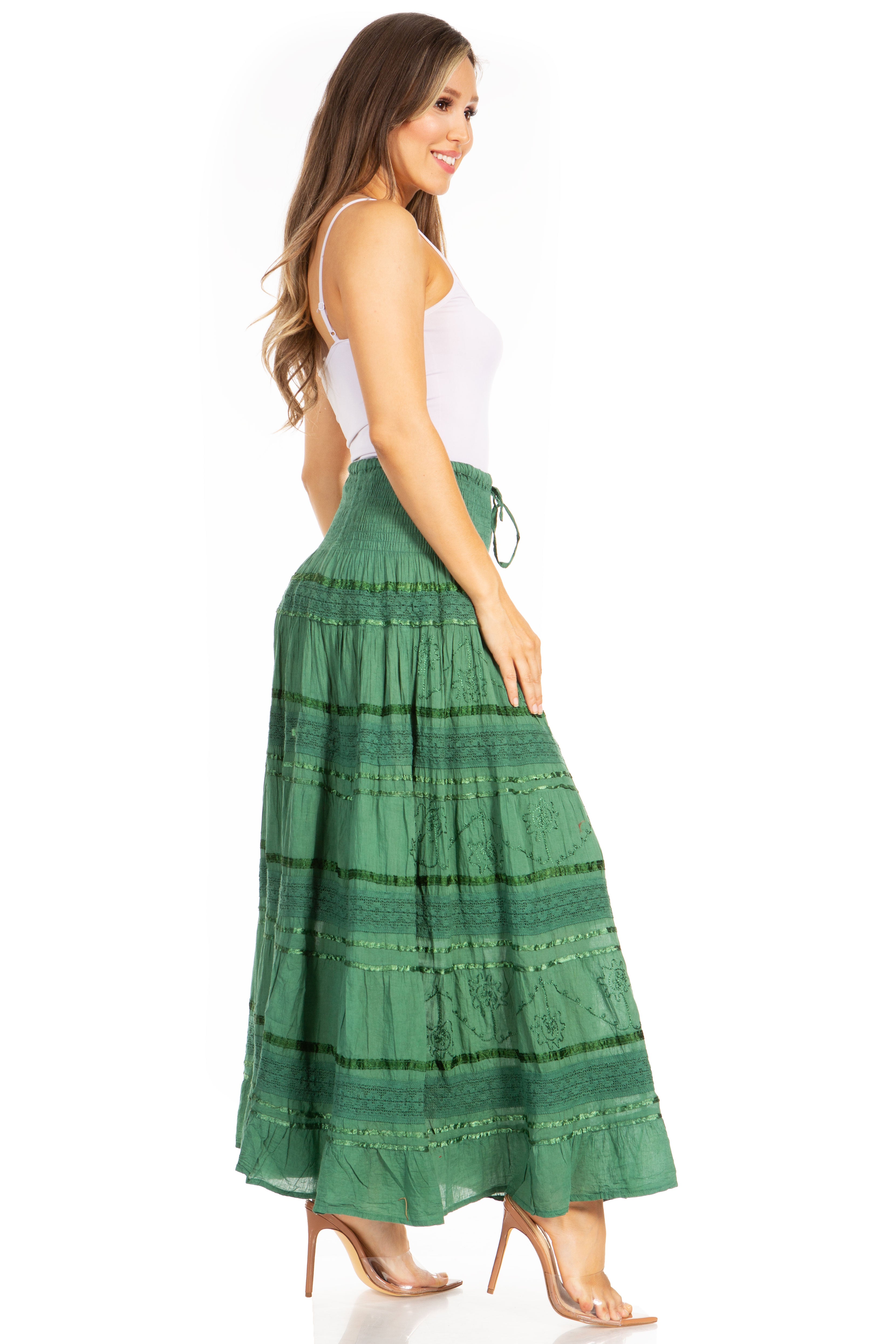 Woman wearing a green tiered skirt on a white background