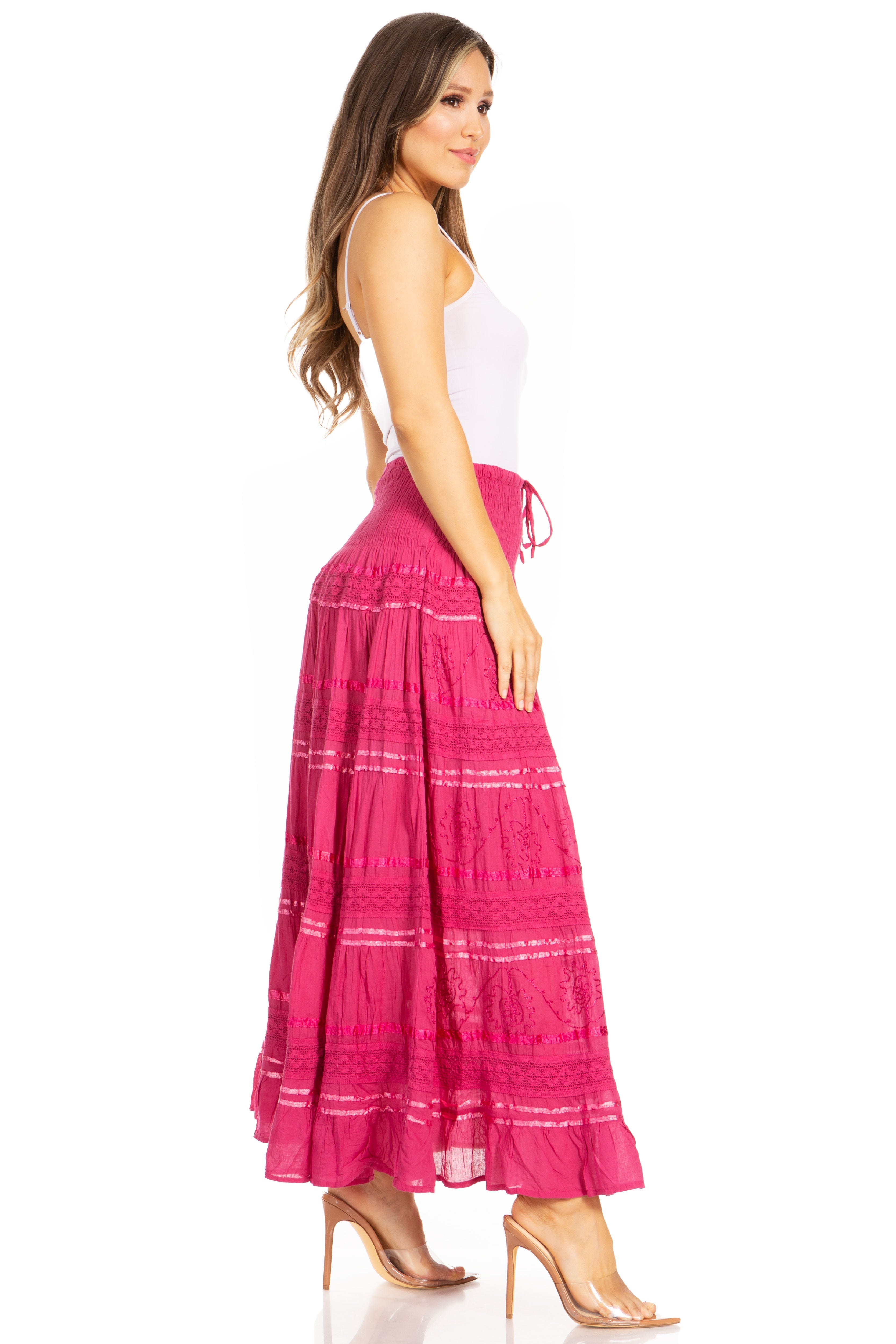 Woman wearing a pink skirt with white stripes on a white background
