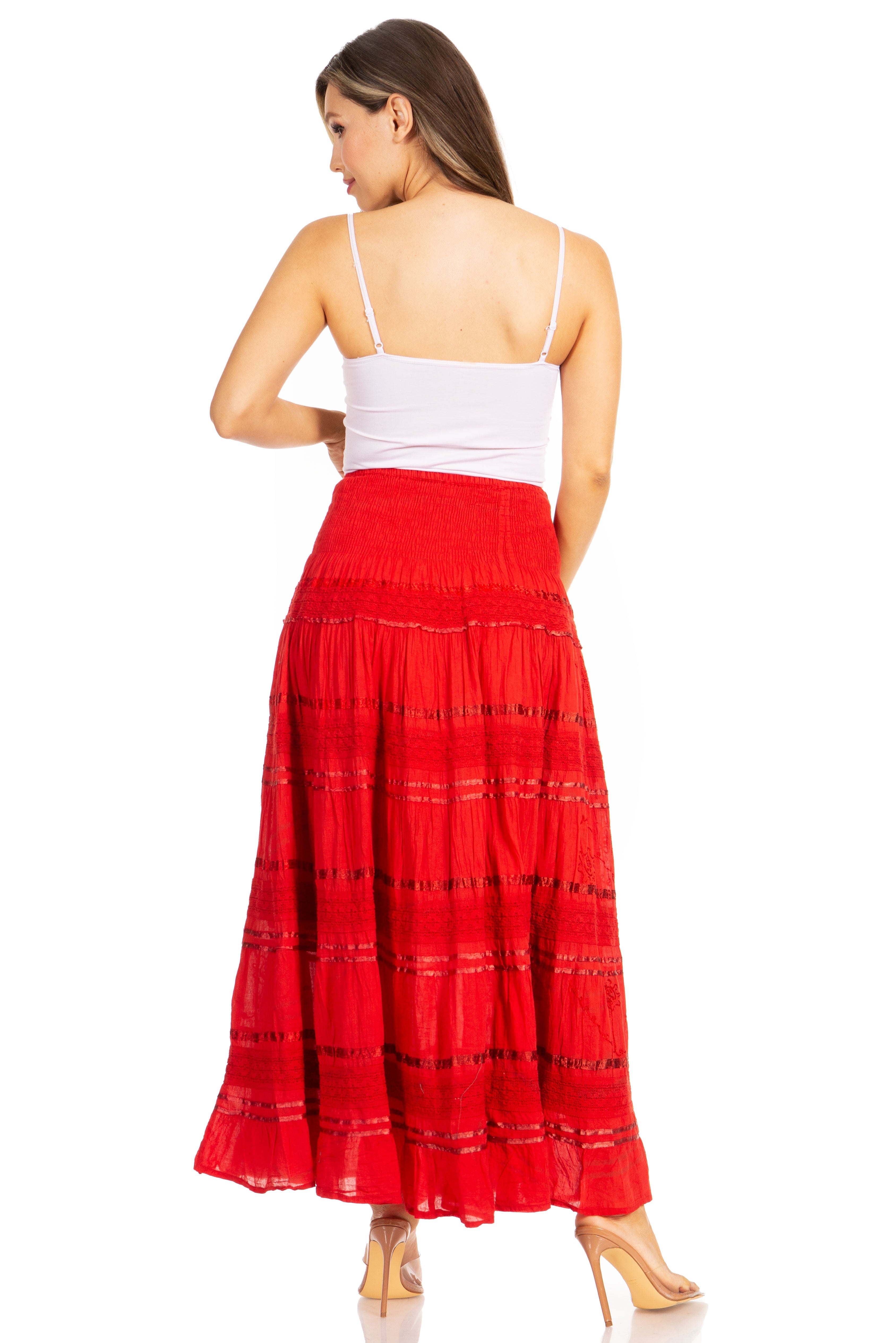 Woman wearing a red skirt and white top on a white background