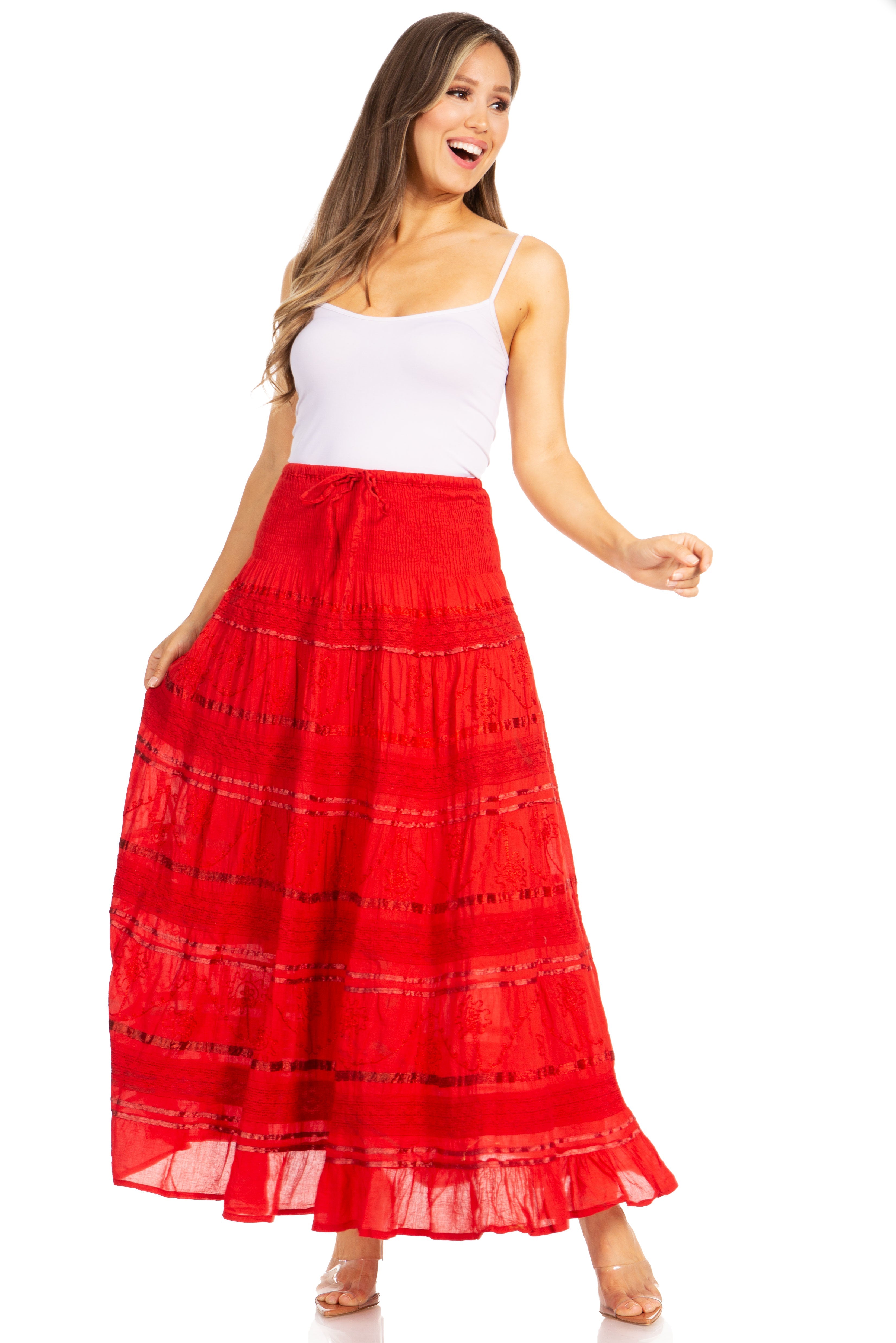 Woman wearing a red skirt and white top on a white background