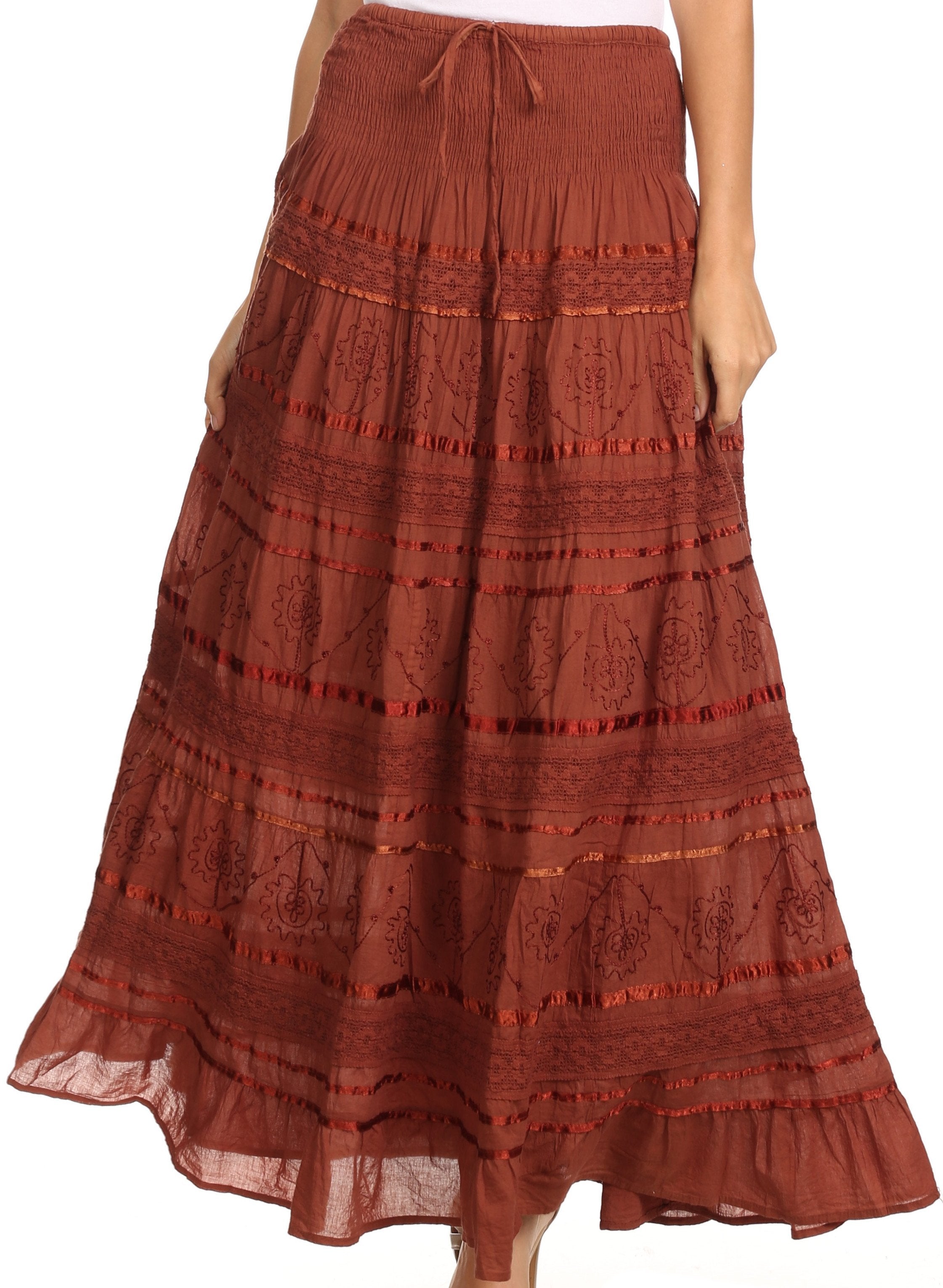 Long rust-colored skirt with lace details on a white background