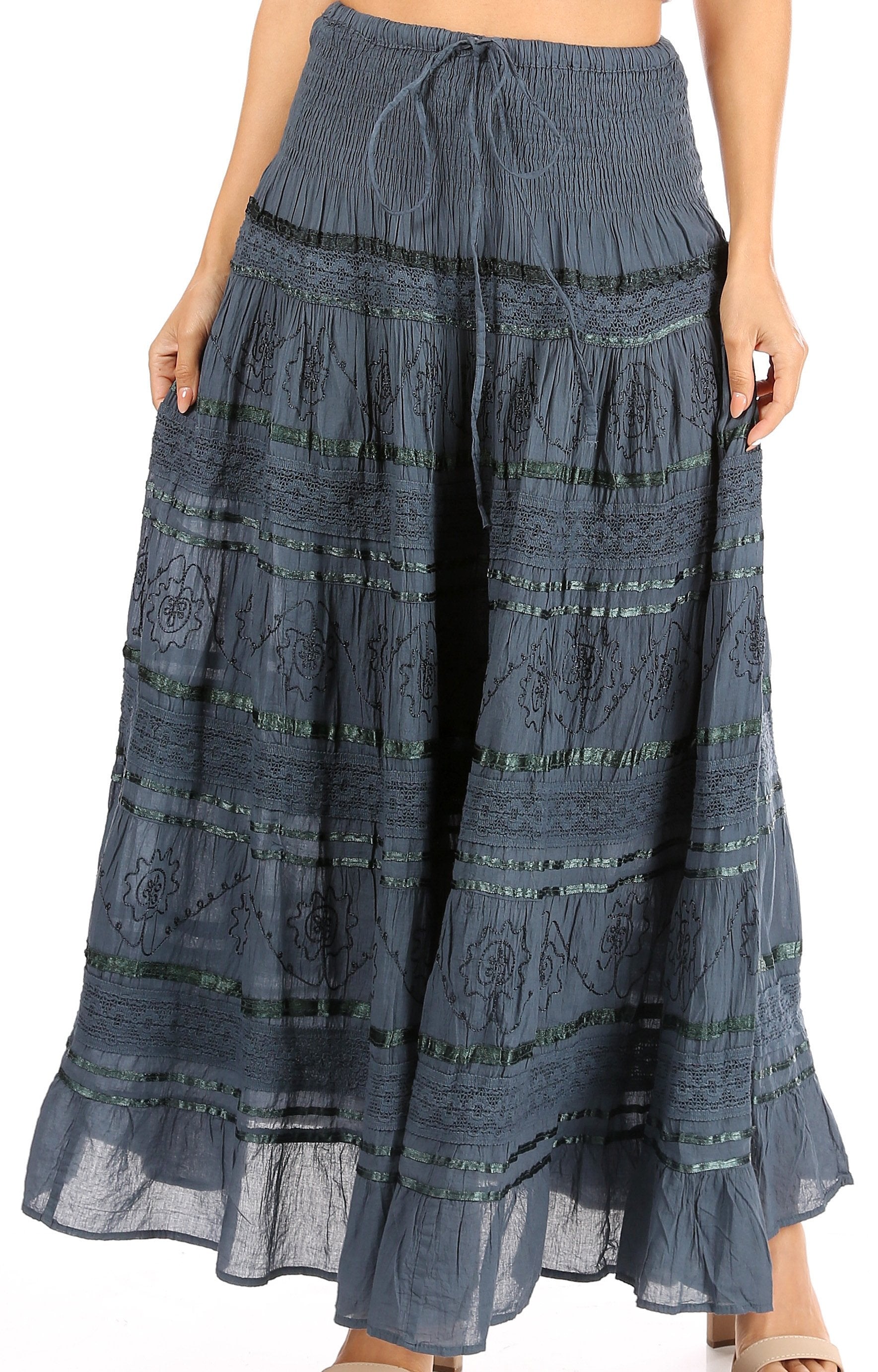 Long blue skirt with patterns on a white background