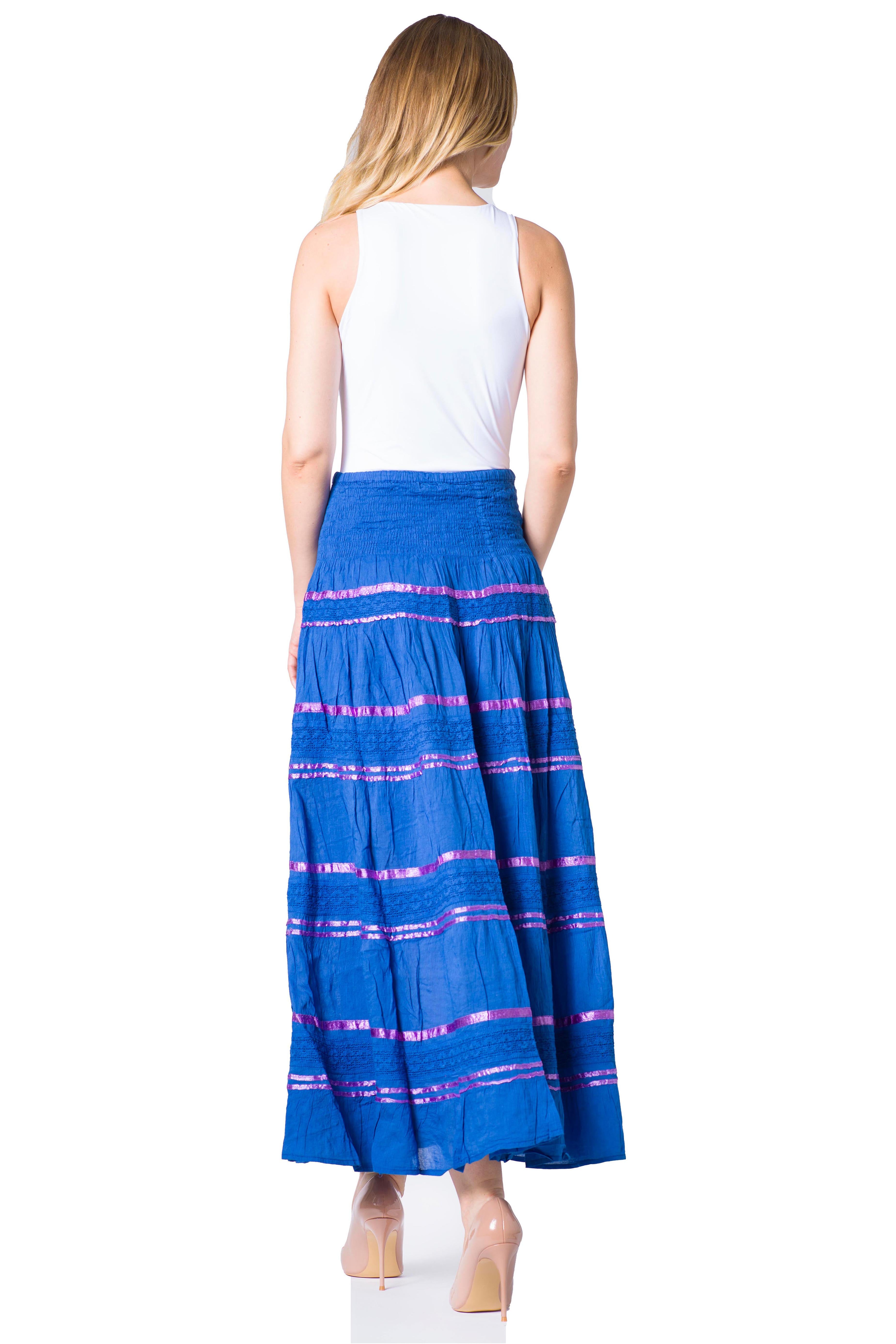 Woman wearing a blue and pink striped skirt on a white background