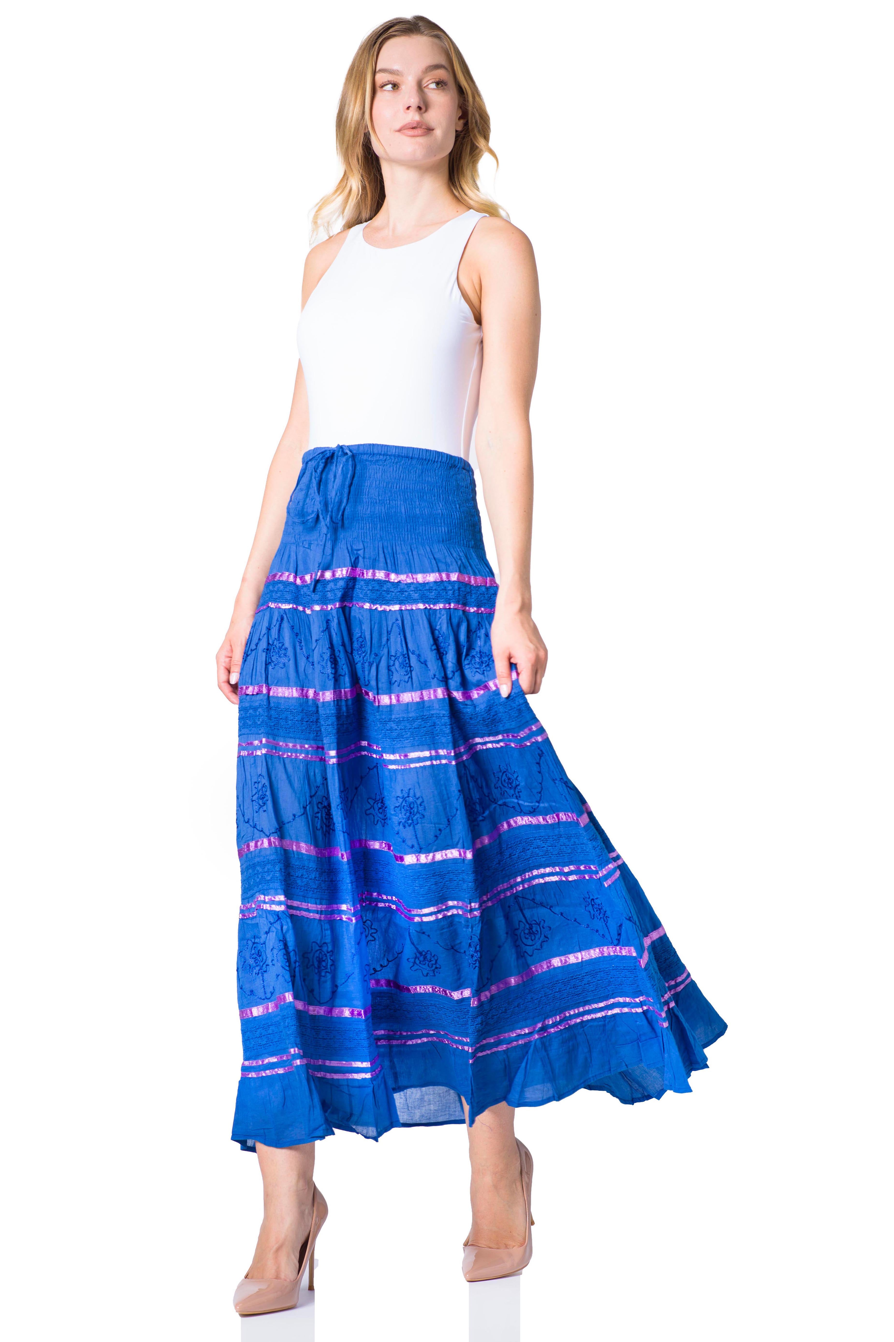 Woman wearing a blue and pink striped skirt on a white background