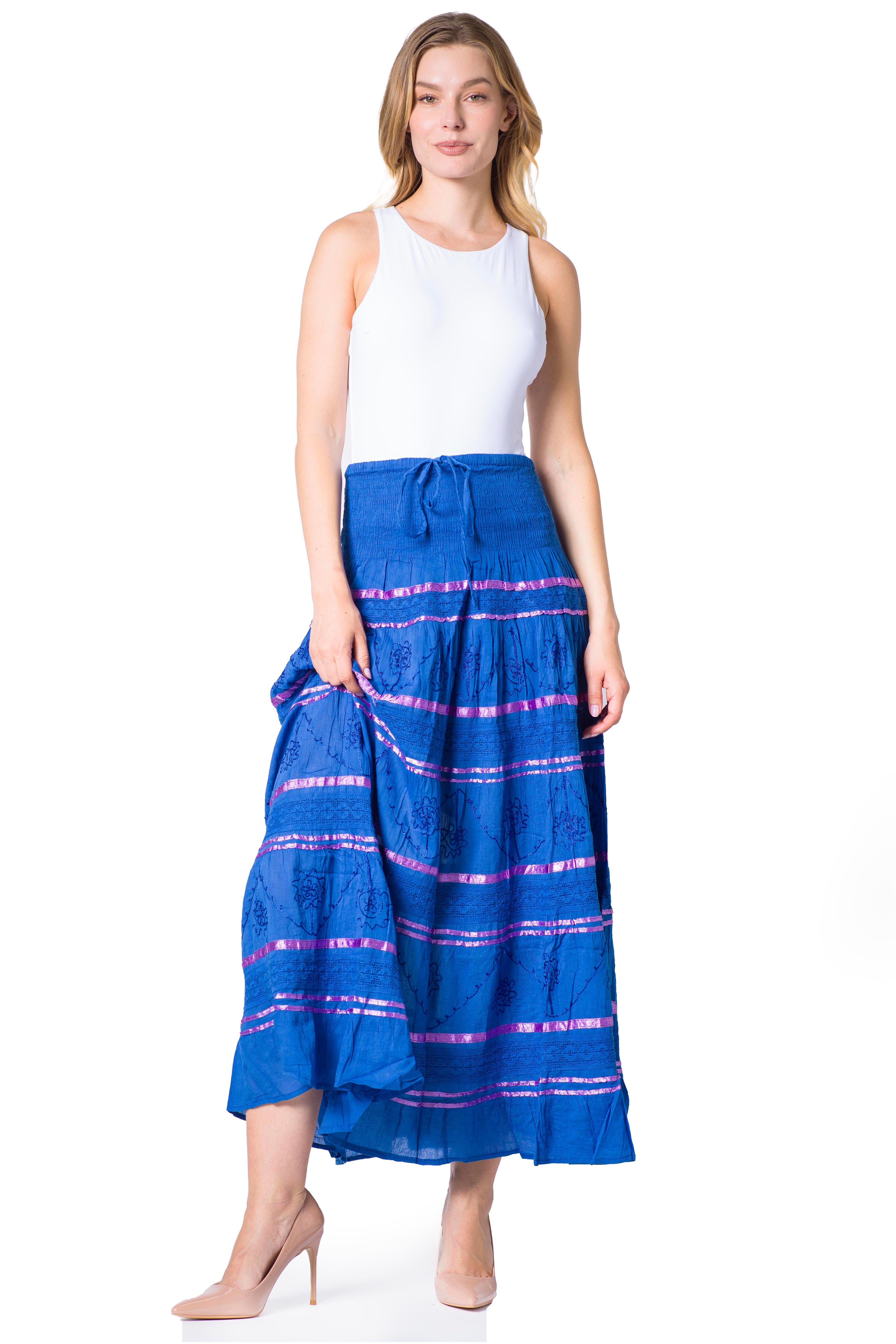 Woman wearing a blue skirt with pink stripes on a white background