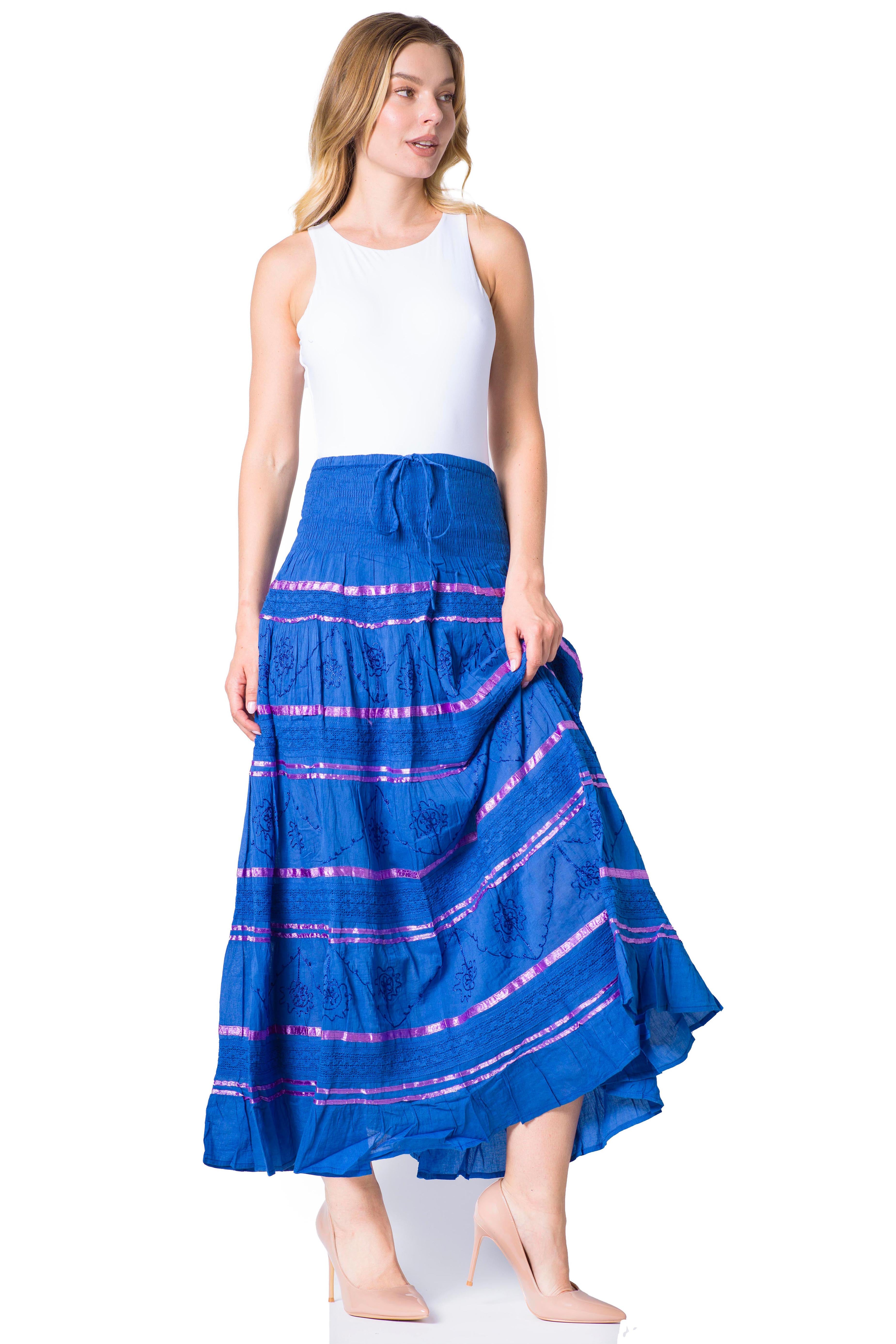 Woman wearing a blue skirt with pink stripes on a white background