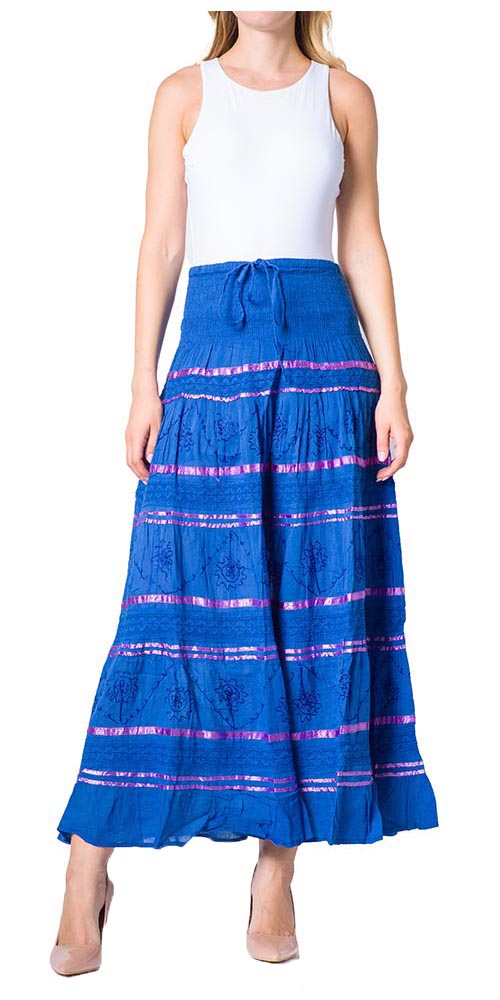 Woman wearing a blue and pink striped skirt with a white top on a white background