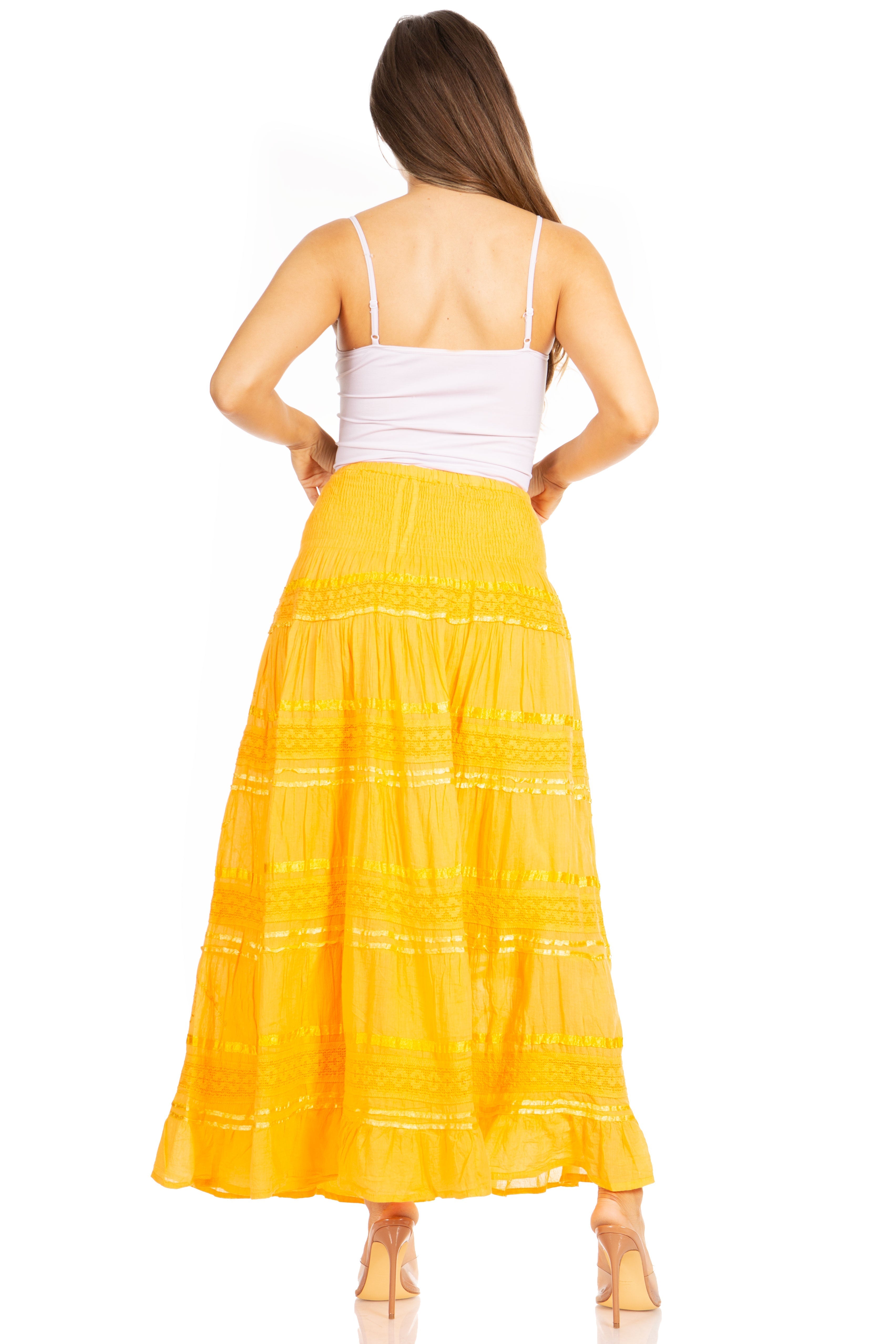 Woman wearing a yellow dress with a white background