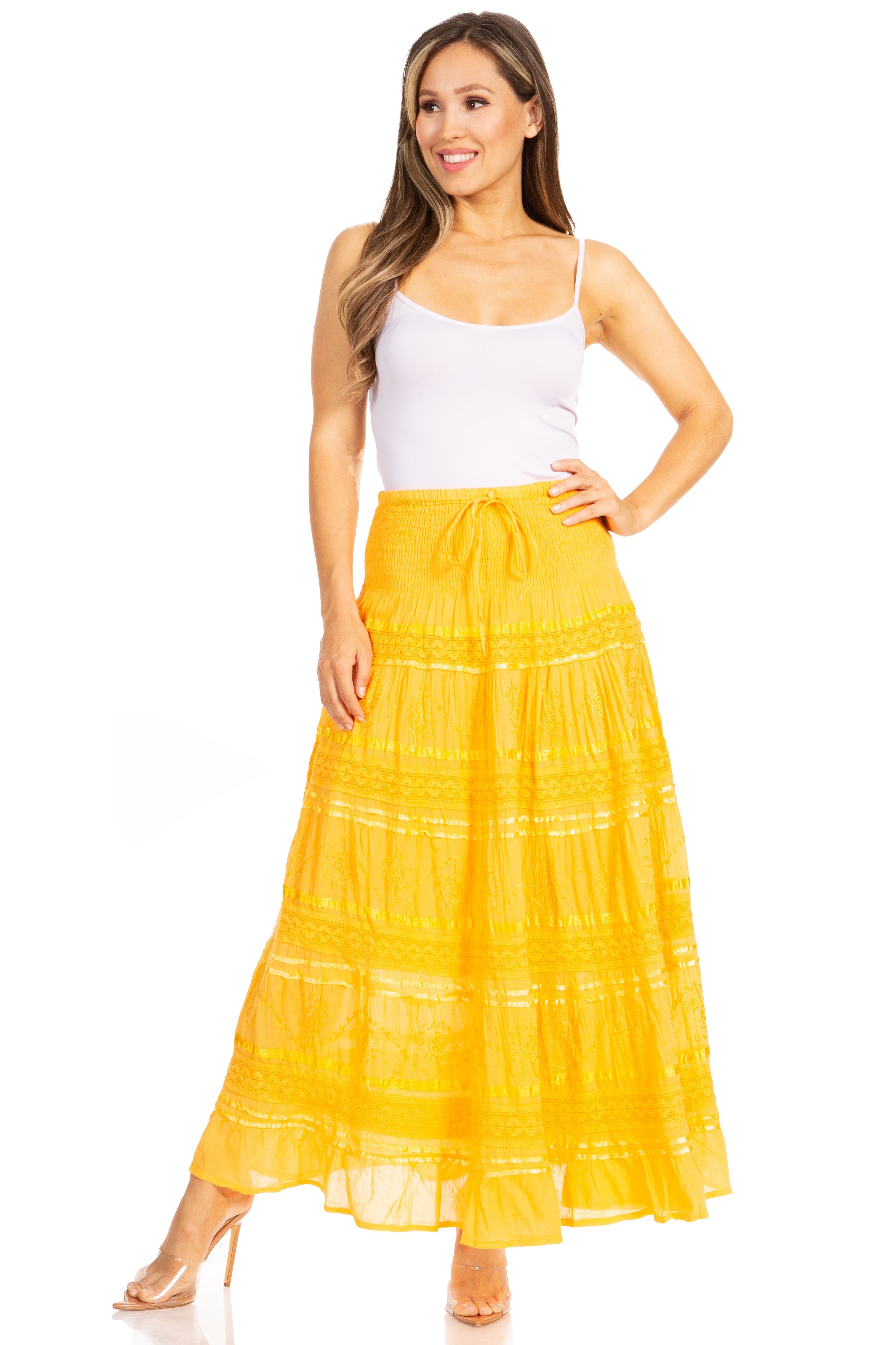 Woman wearing a yellow skirt and white top on a white background