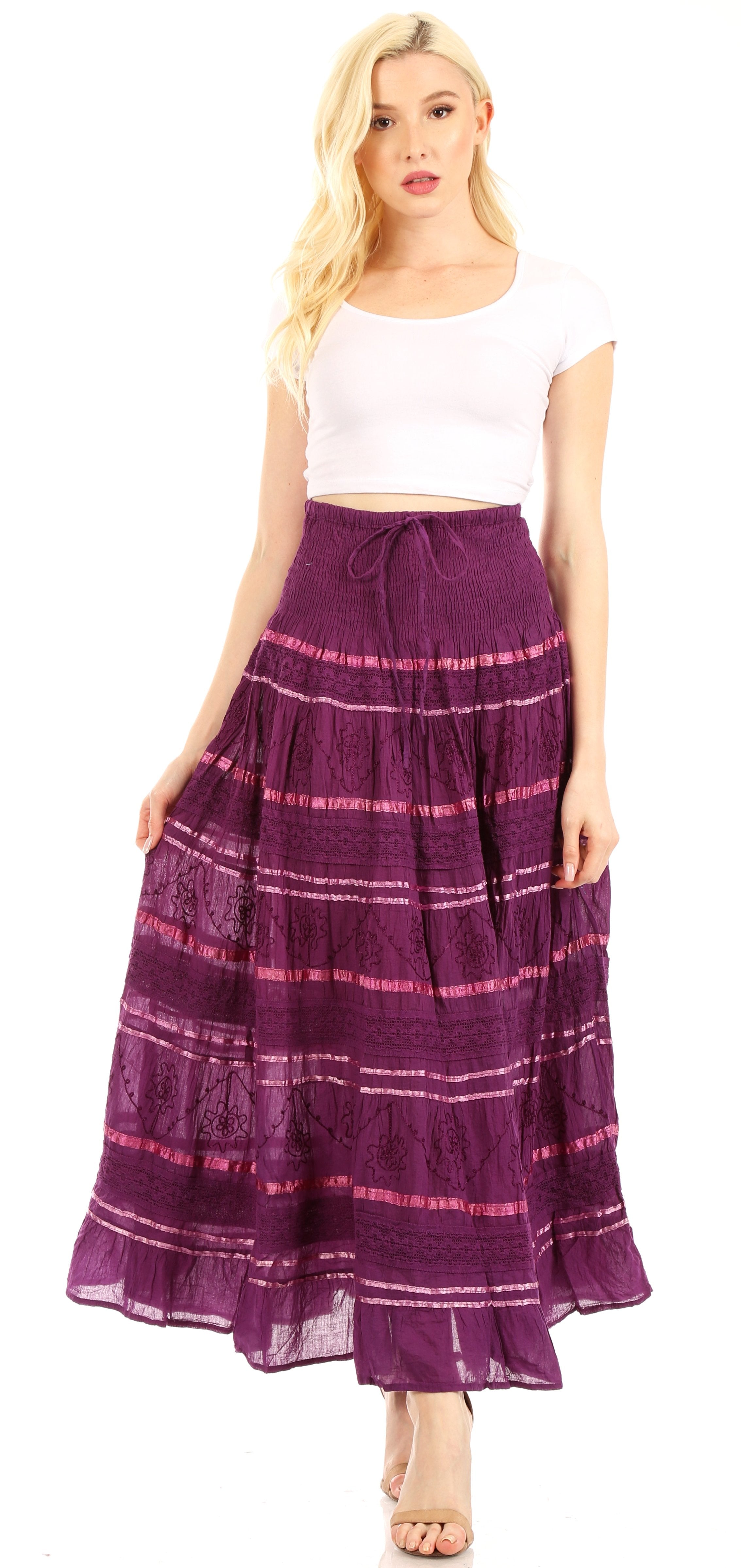 Woman wearing a purple skirt with pink stripes on a white background