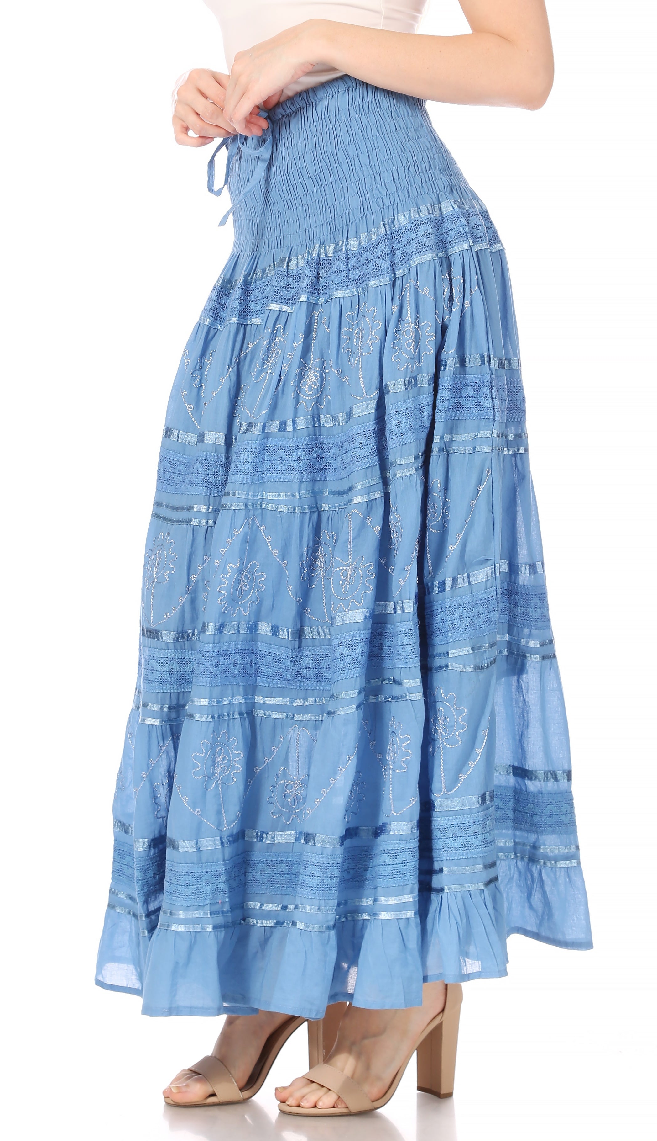Blue tiered skirt with white patterns on a white background
