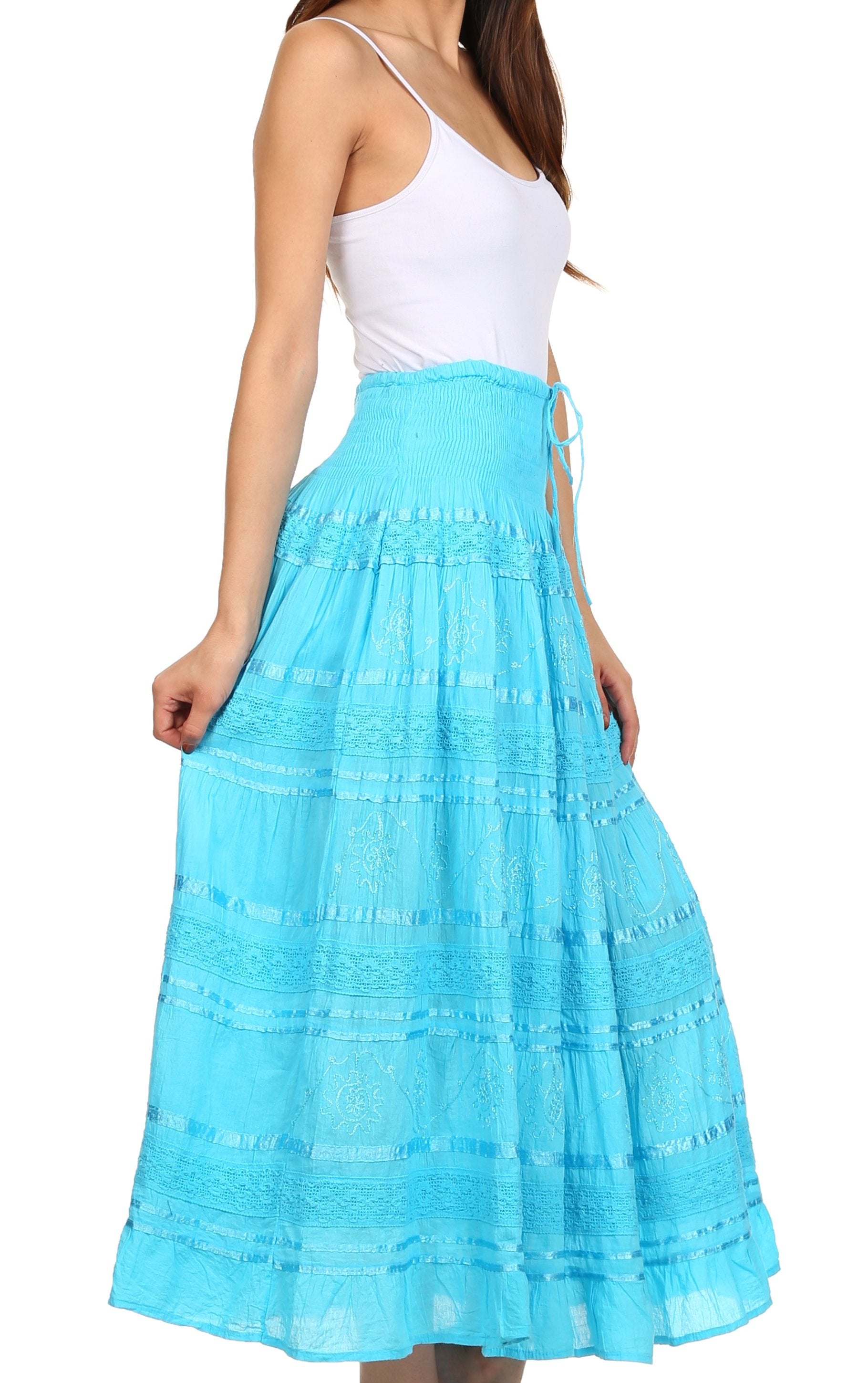 Woman wearing a white top and blue skirt on a white background