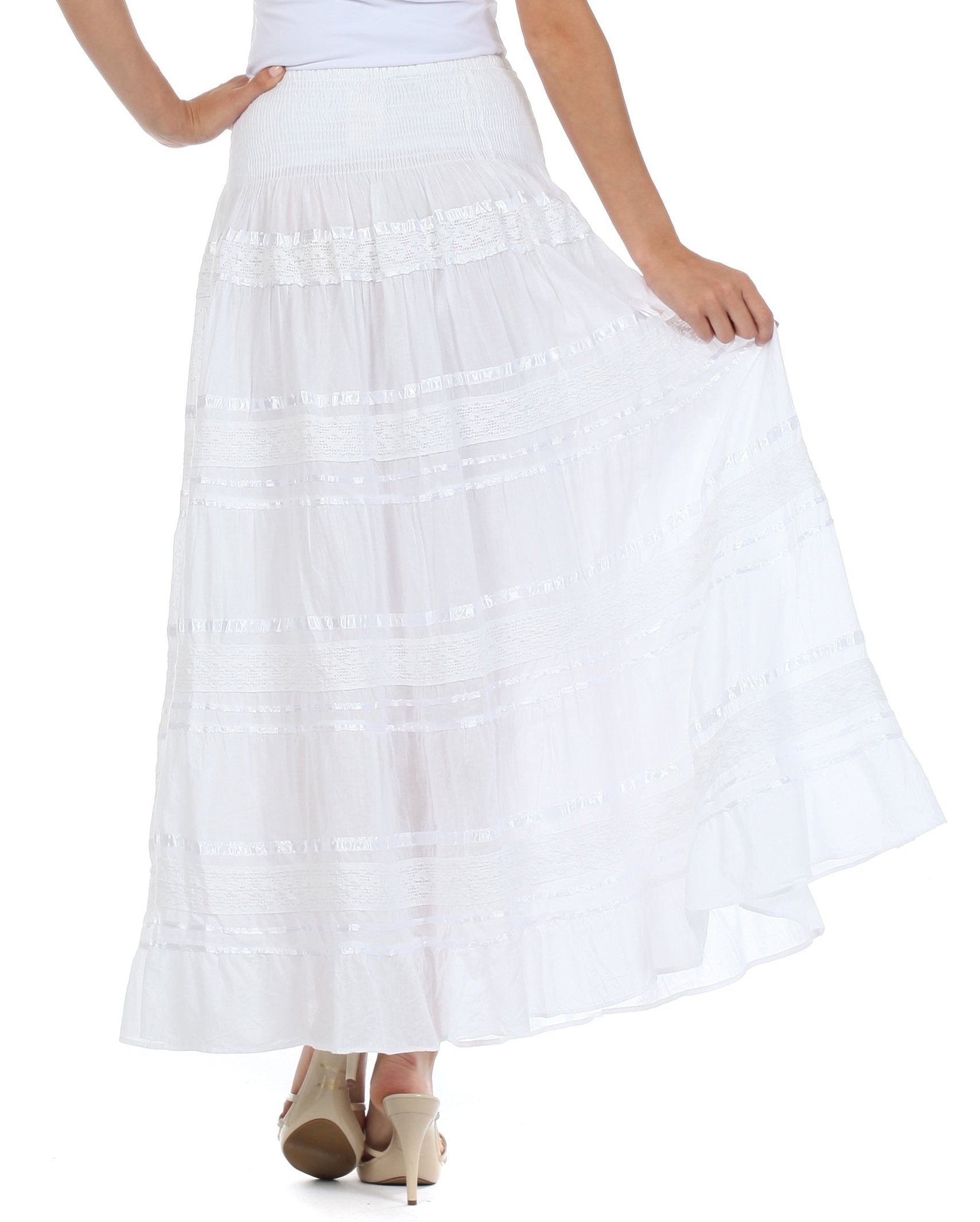 White skirt worn by a person on a white background