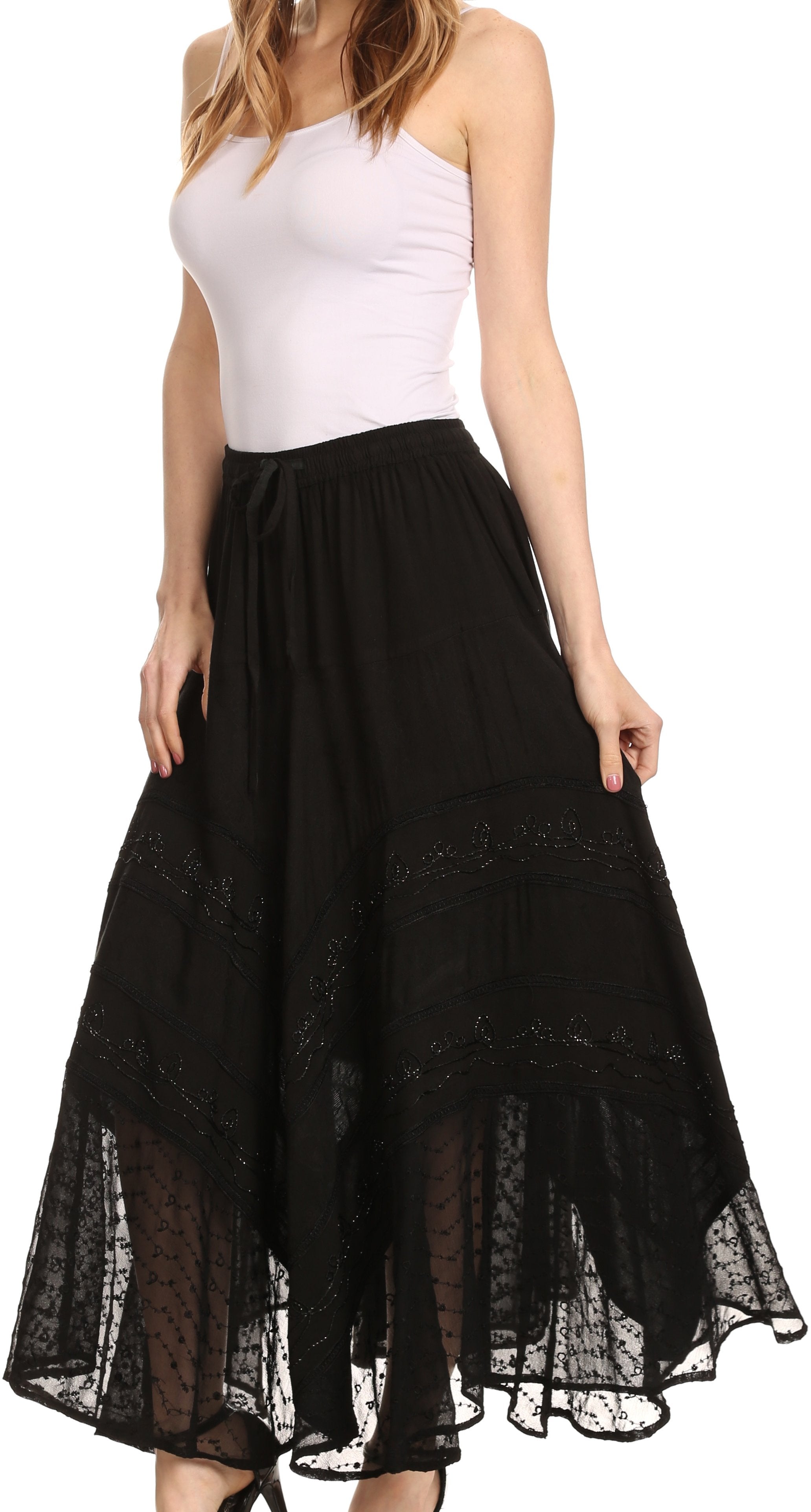 Woman wearing a white top and black lace-trimmed skirt on a white background