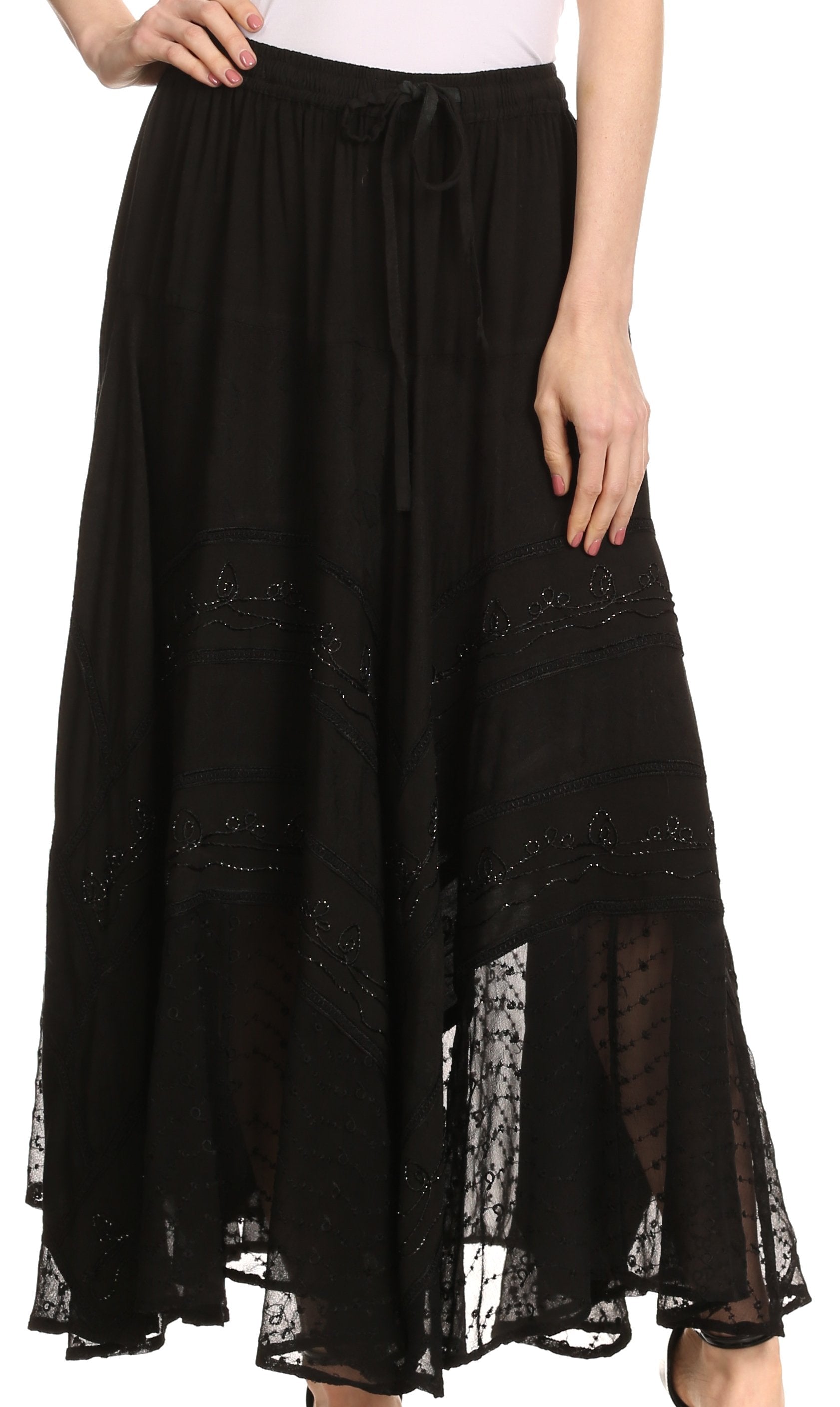 Black lace skirt worn by a person on a white background