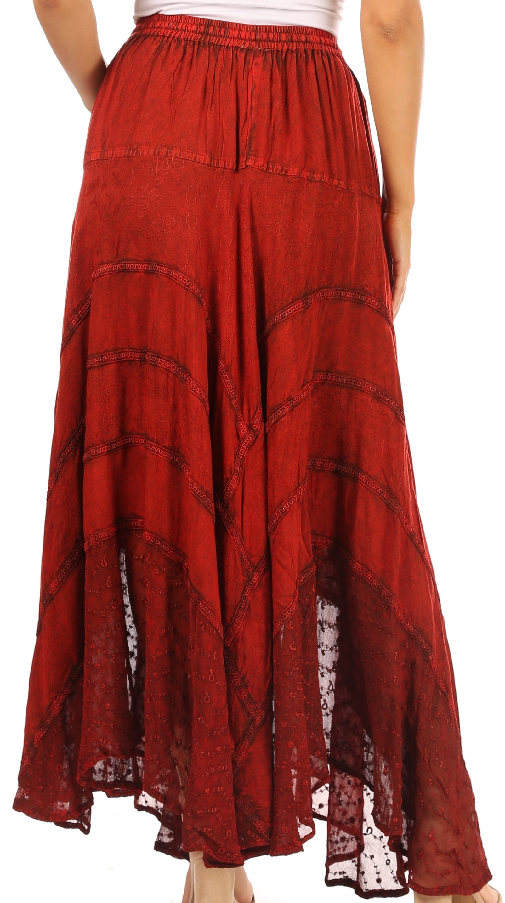Red patterned skirt worn by a person on a white background