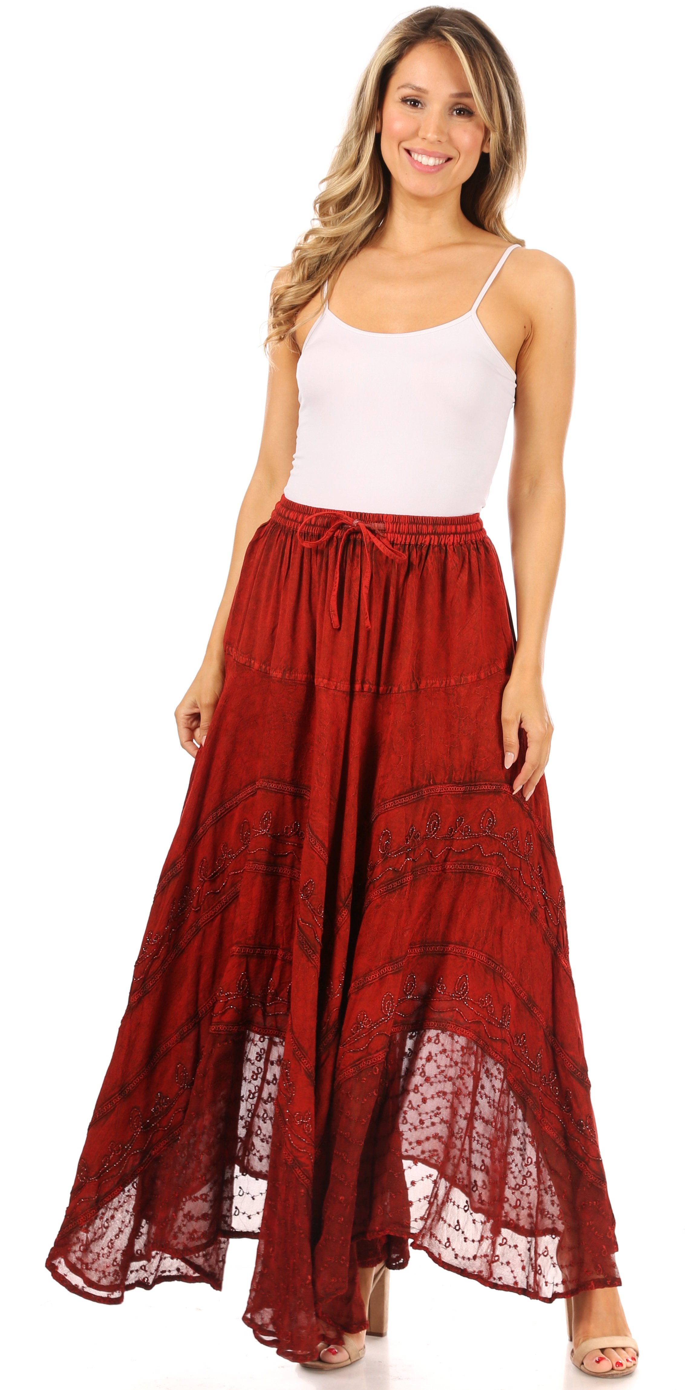Woman wearing a white top and red lace skirt on a white background
