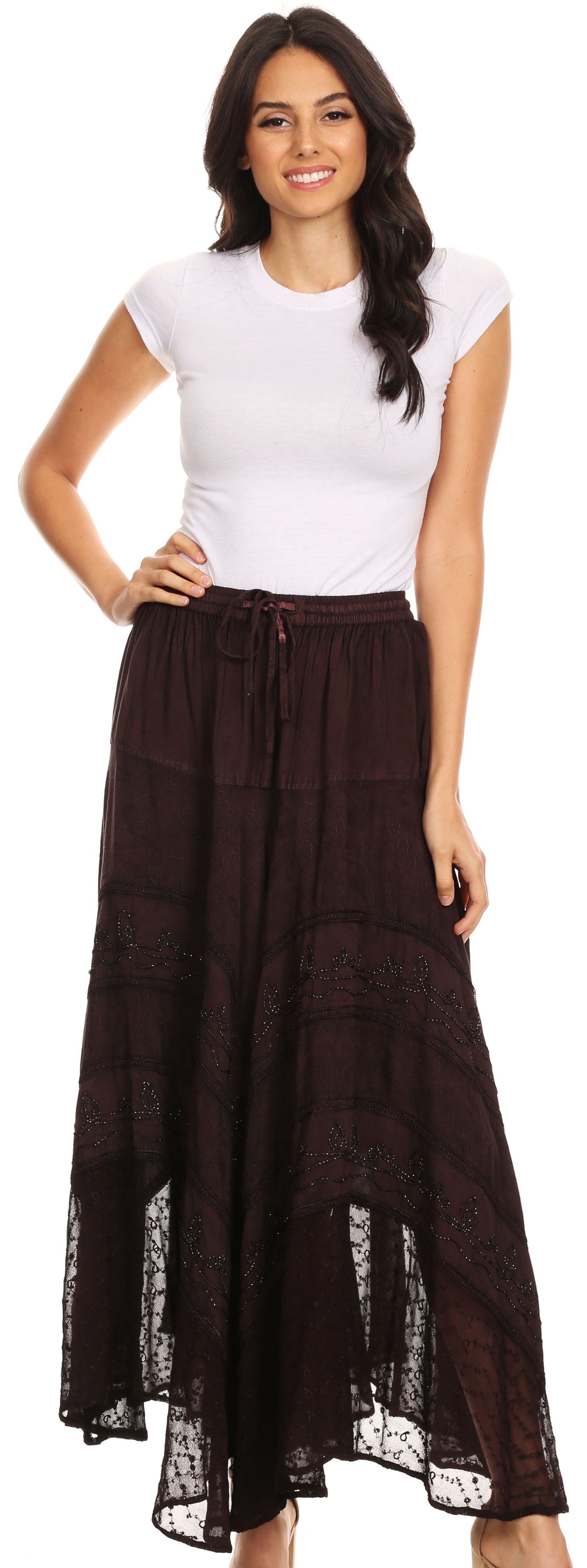 Woman wearing a white top and brown layered skirt on a white background