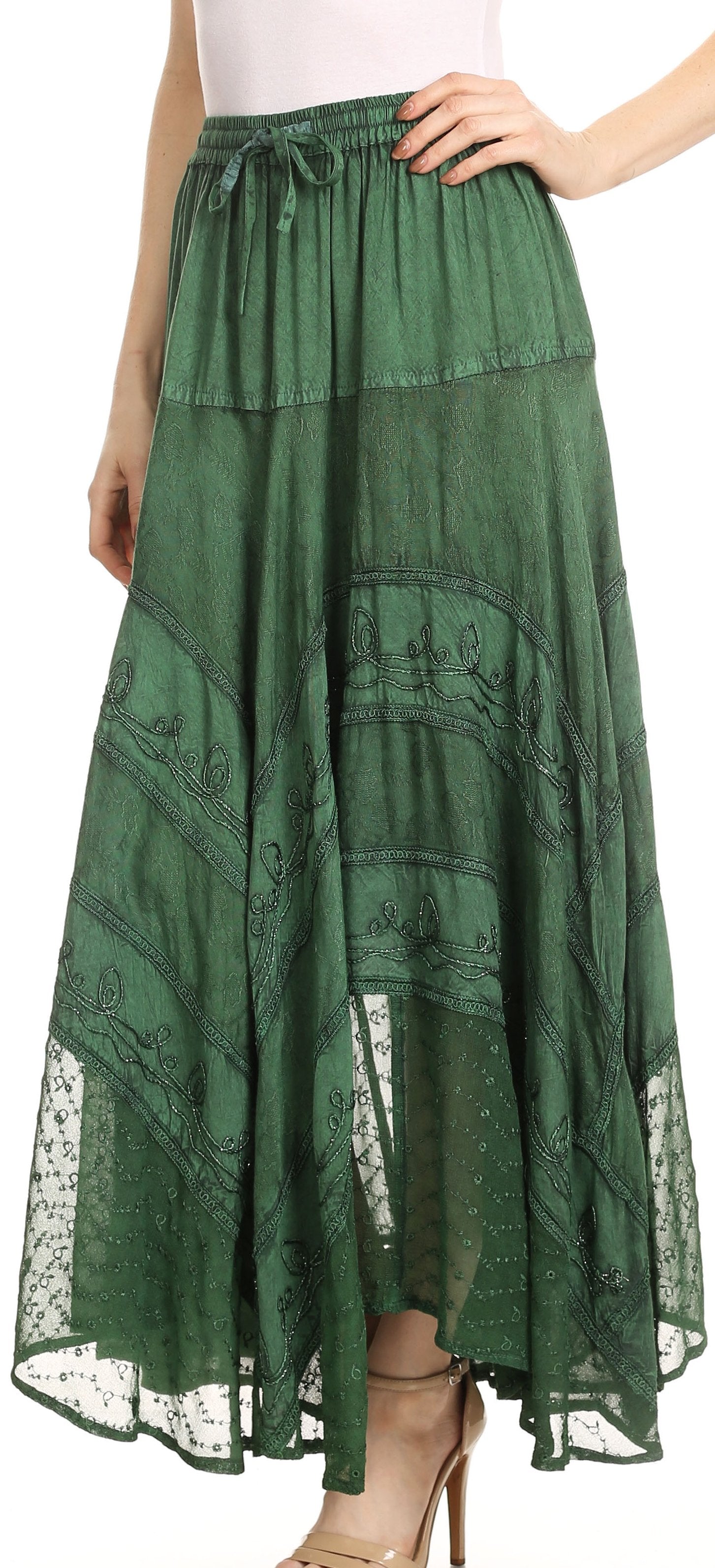 Green lace skirt worn by a person on a white background