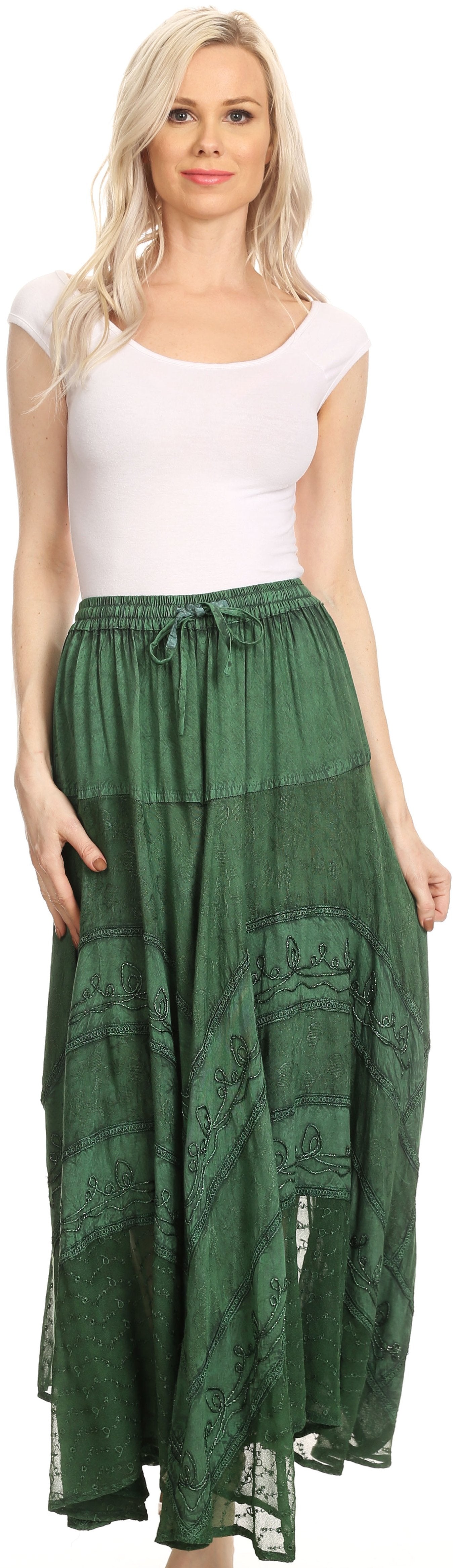 Woman wearing a white top and green long skirt on a white background