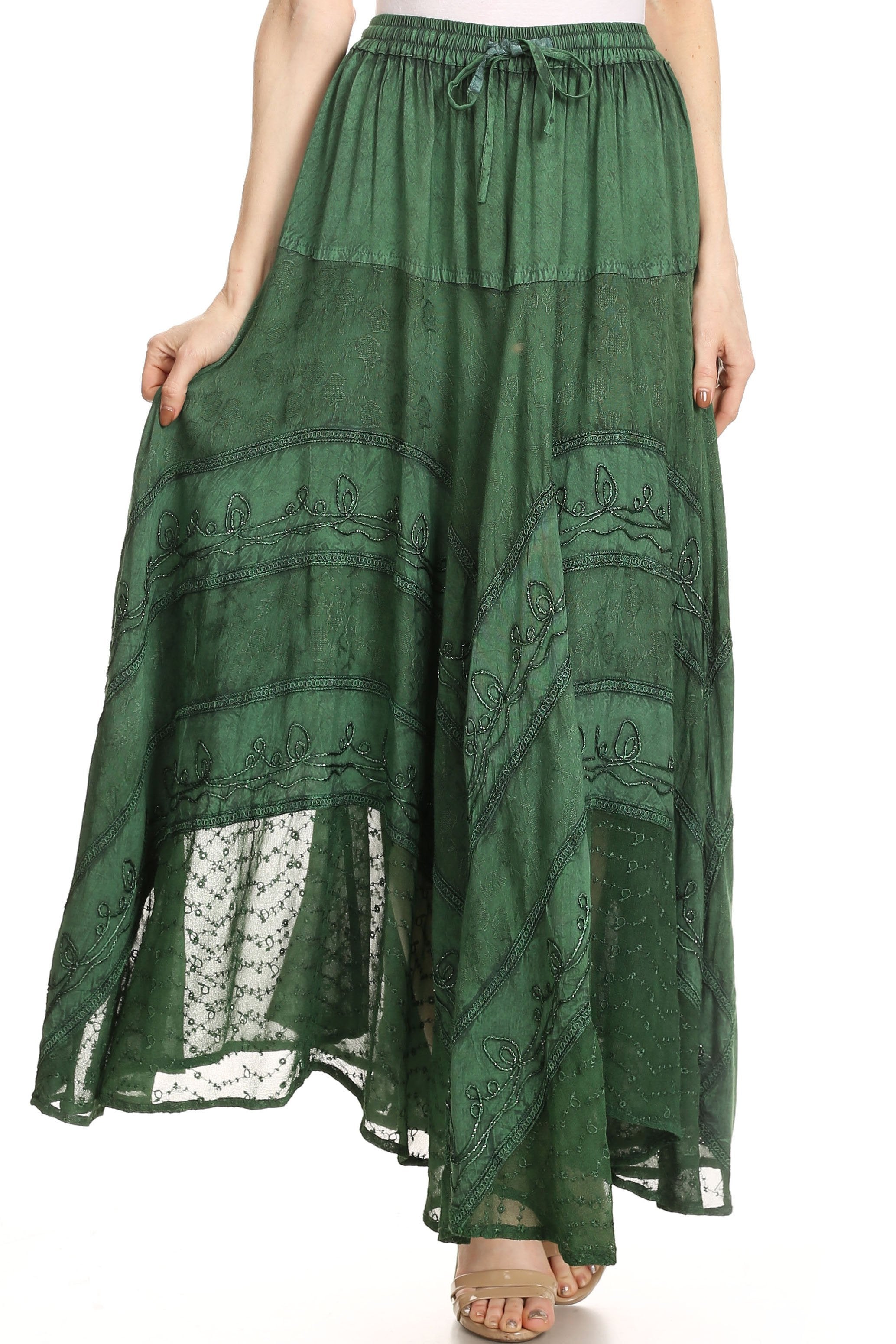 Green patterned skirt with lace overlay on a white background