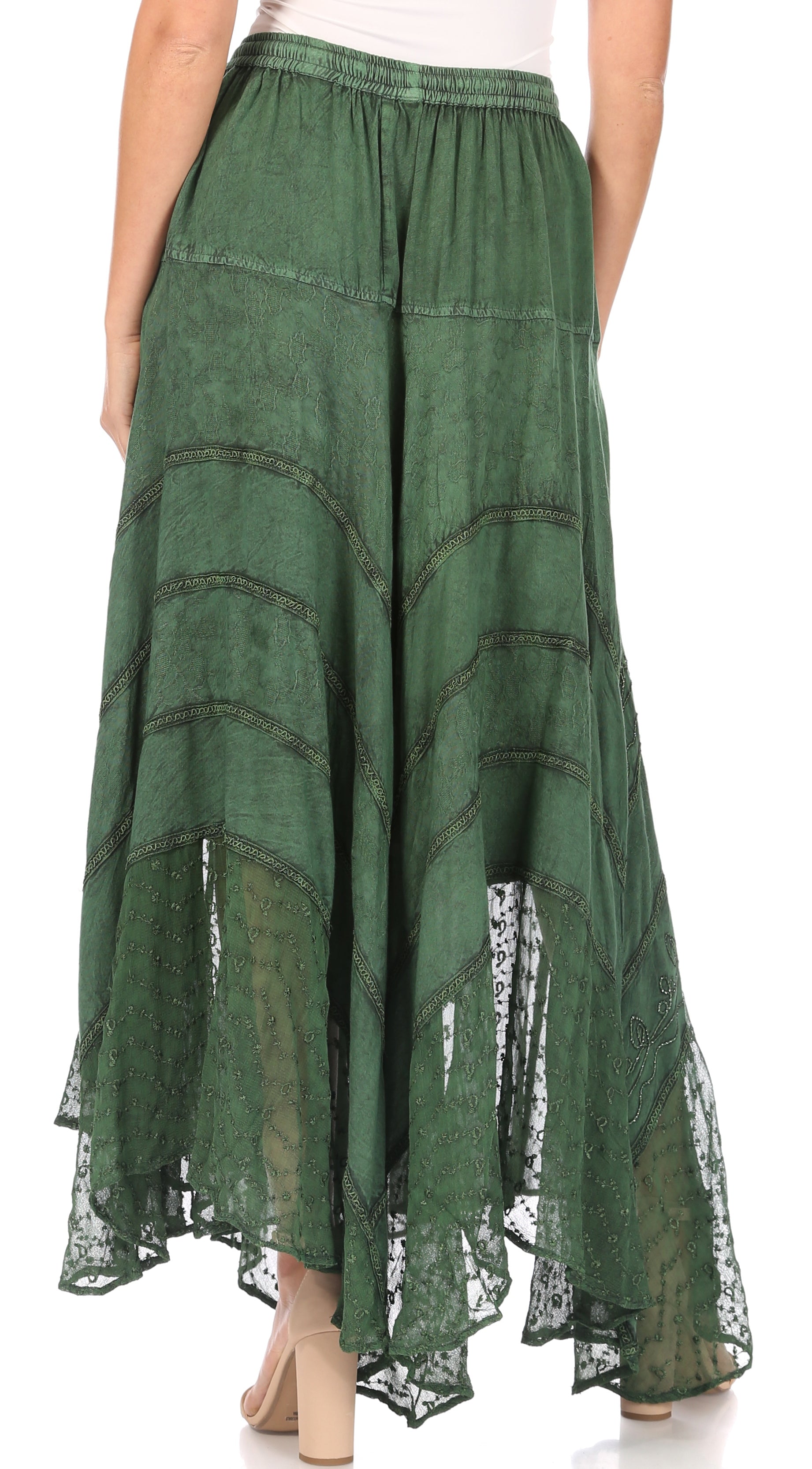 Green lace skirt worn by a person on a white background