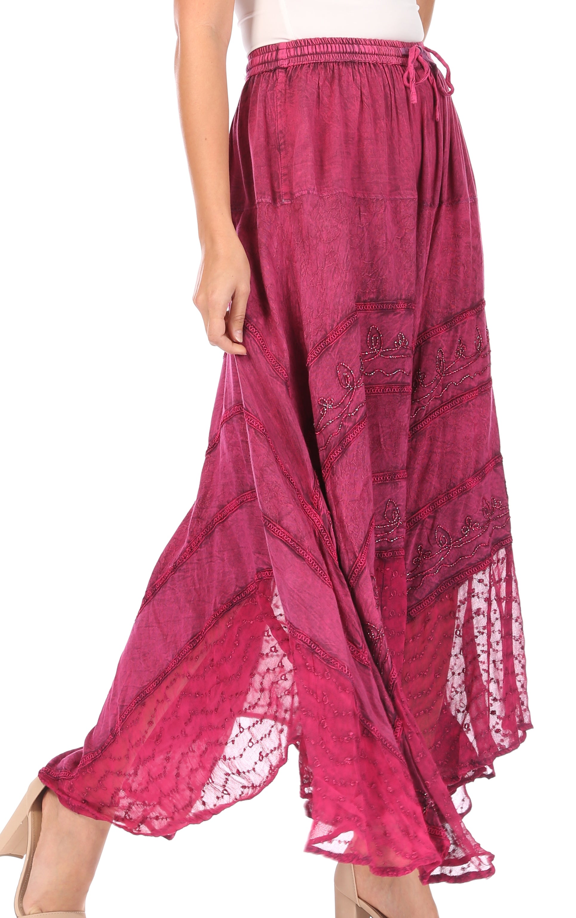 Pink patterned skirt with lace trim on a white background