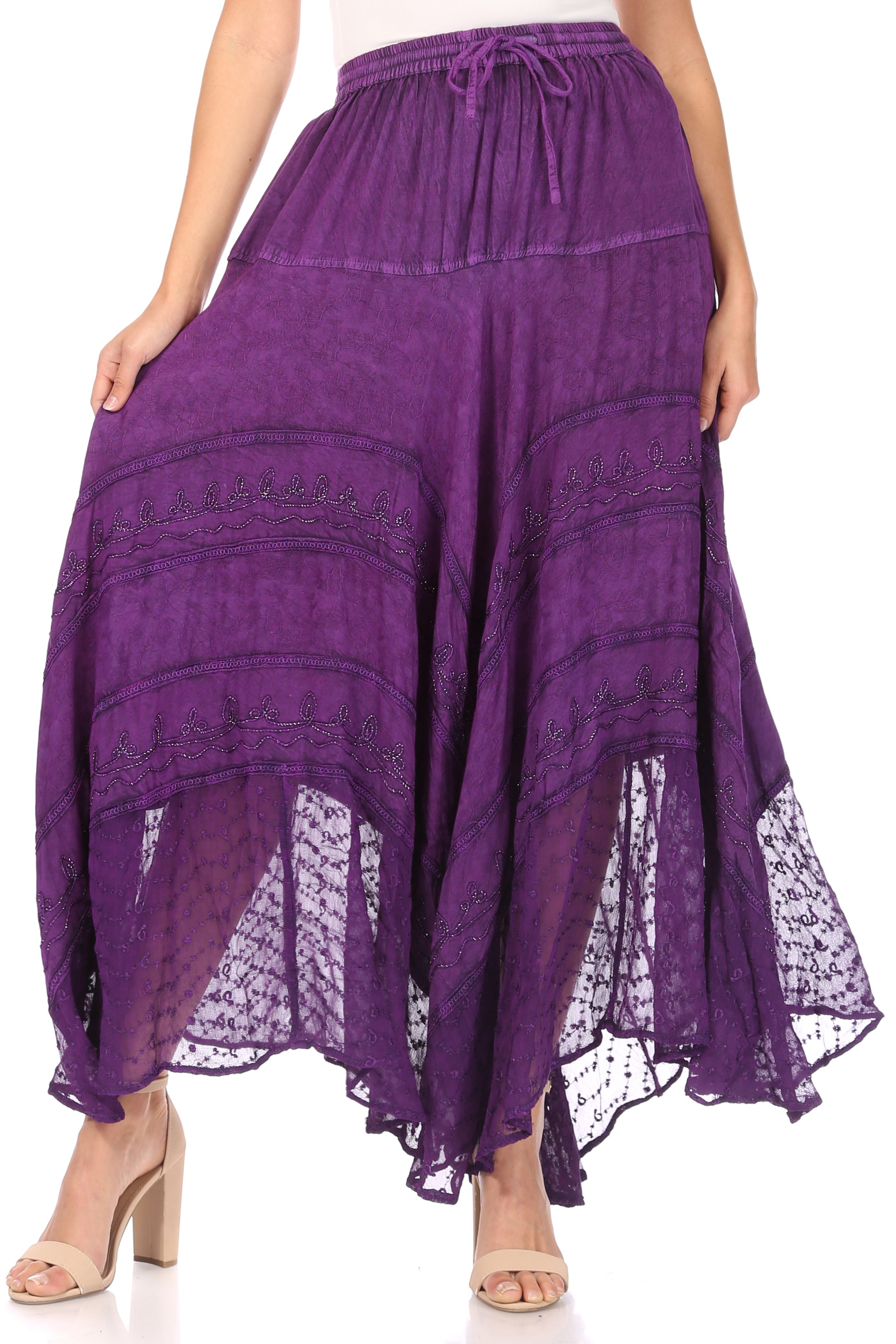Purple lace skirt worn by a person on a white background