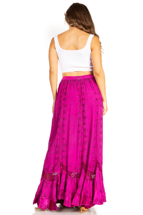 Woman wearing a white top and pink skirt on a white background