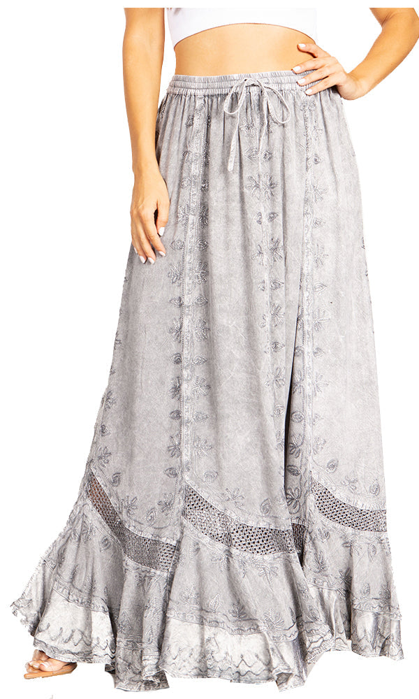 Long gray floral skirt worn by a person on a white background