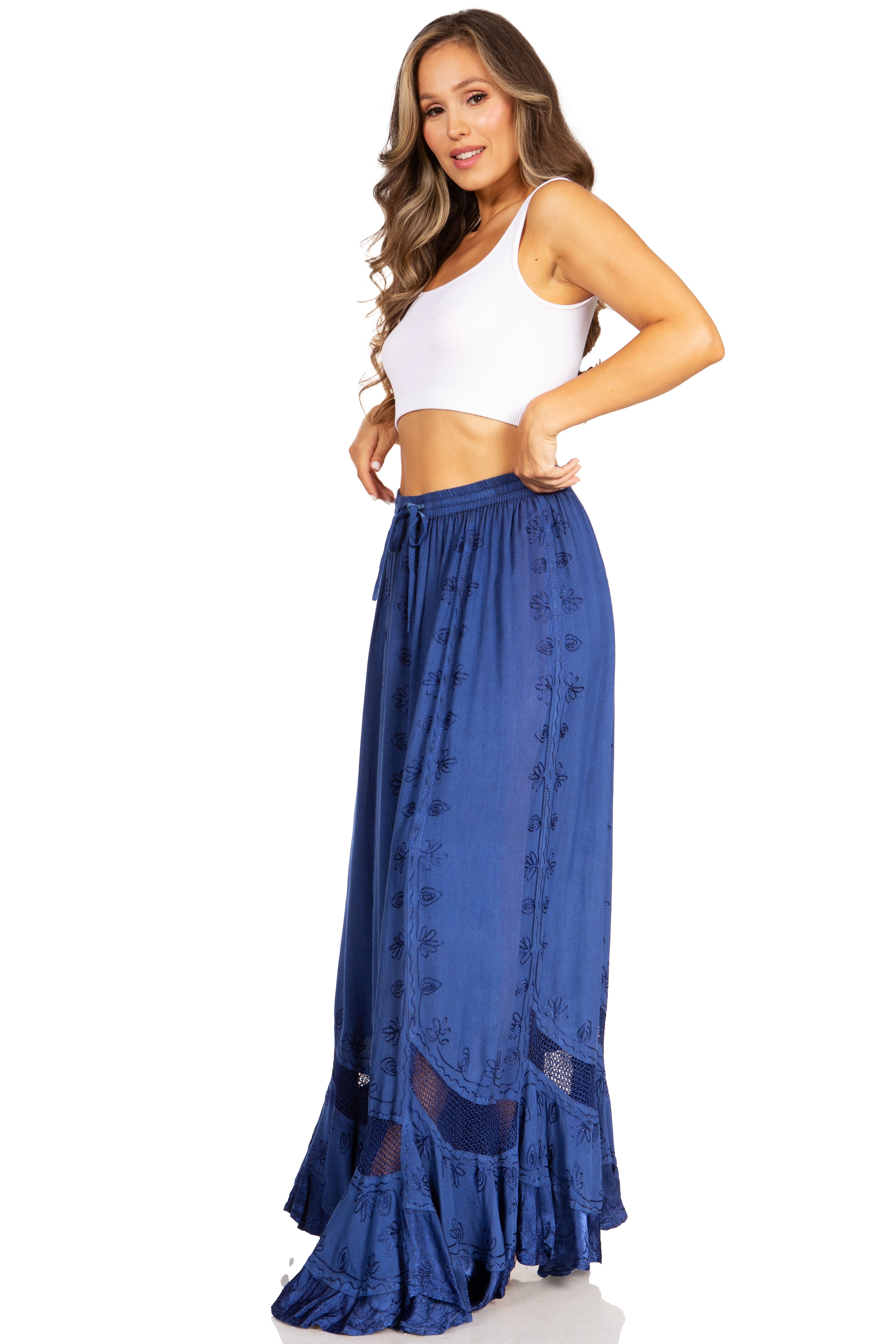 Woman wearing a blue skirt and white top on a white background