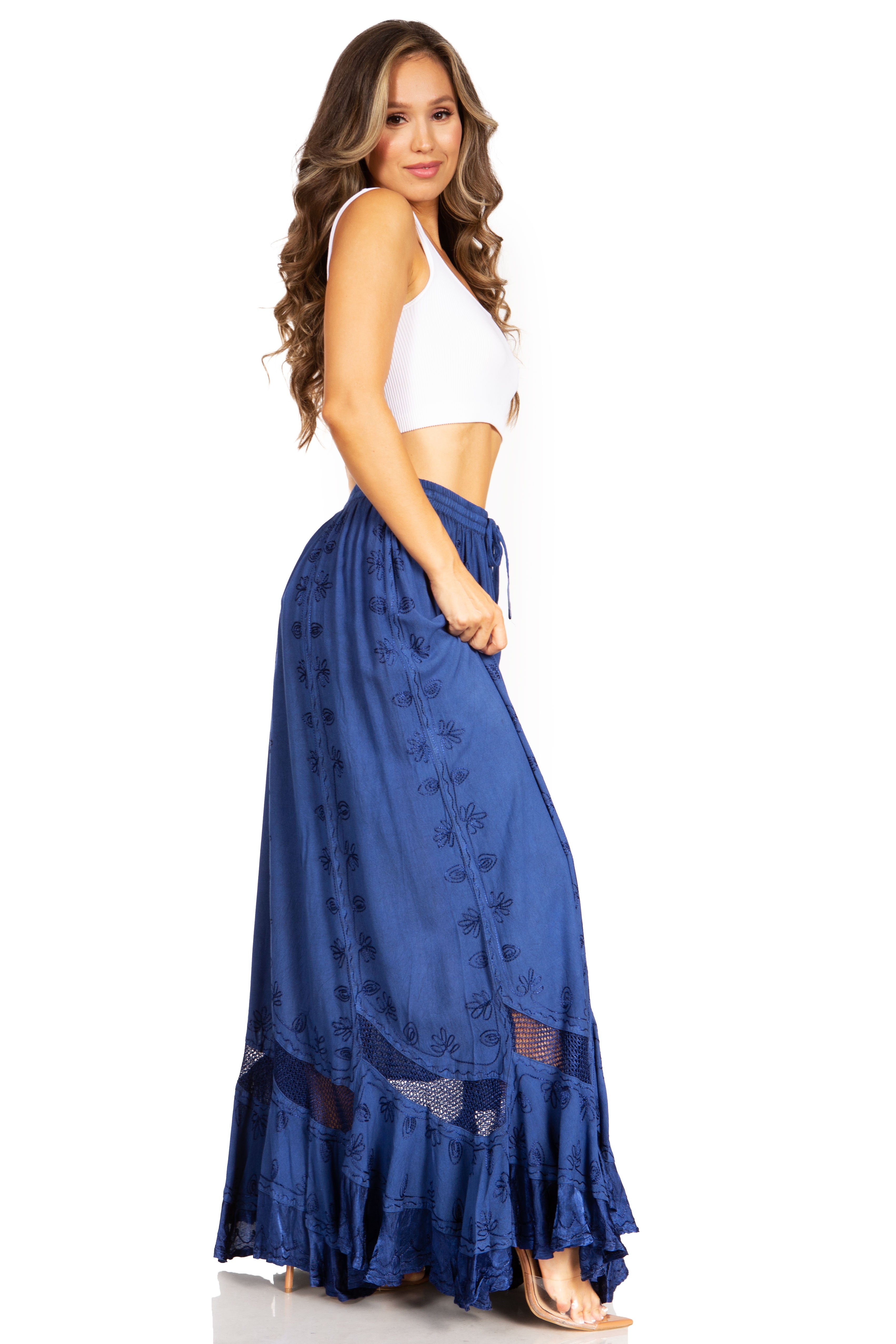 Woman wearing a blue skirt with a white top on a white background