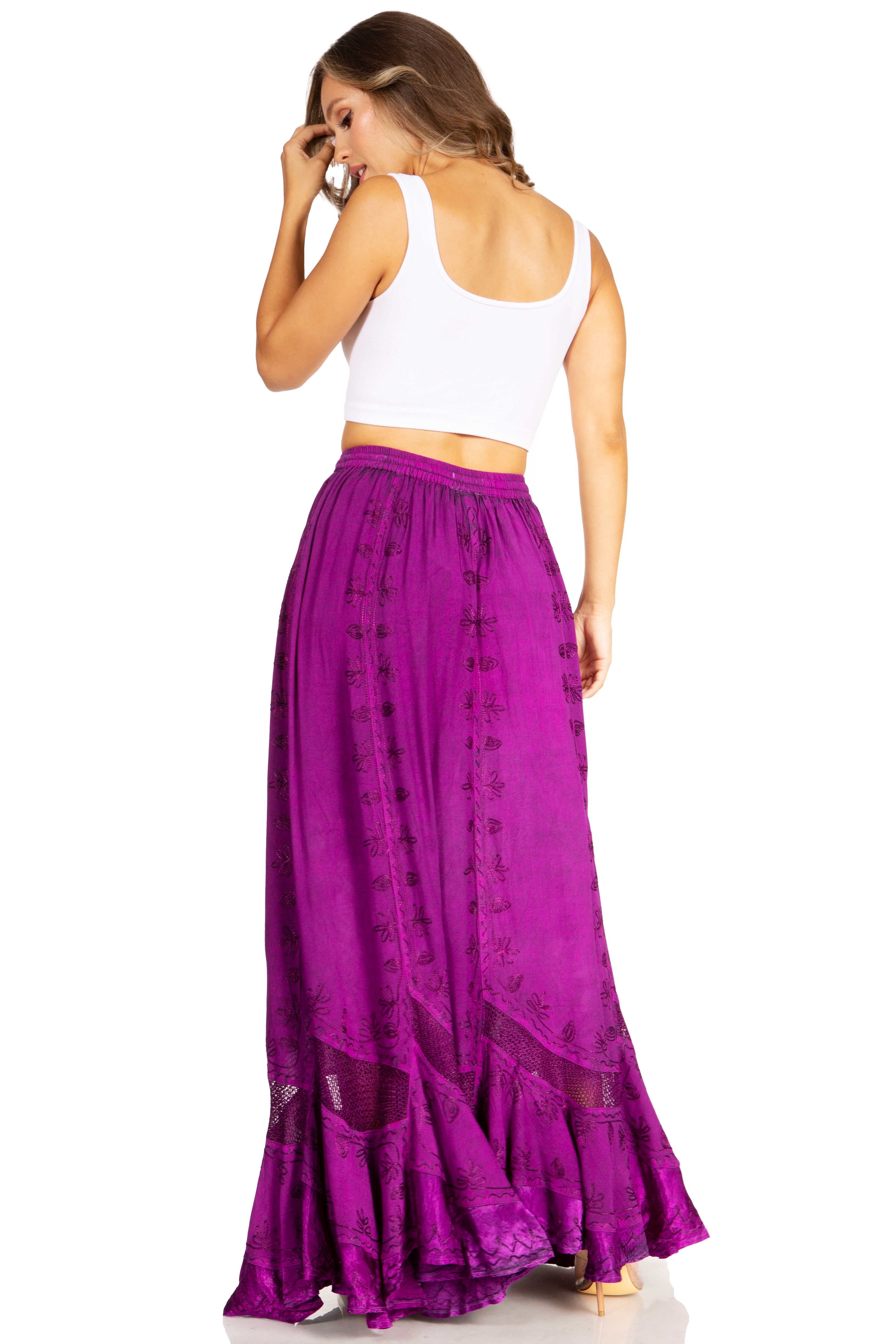 Woman wearing a white top and purple skirt on a white background