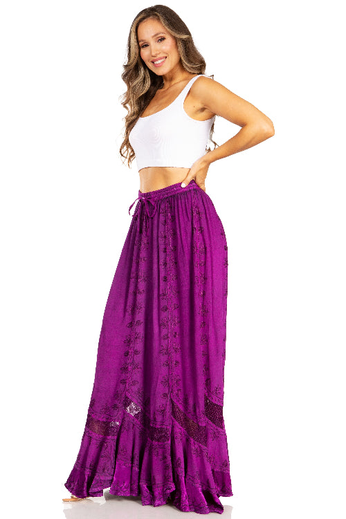 Woman wearing a white top and purple skirt on a white background
