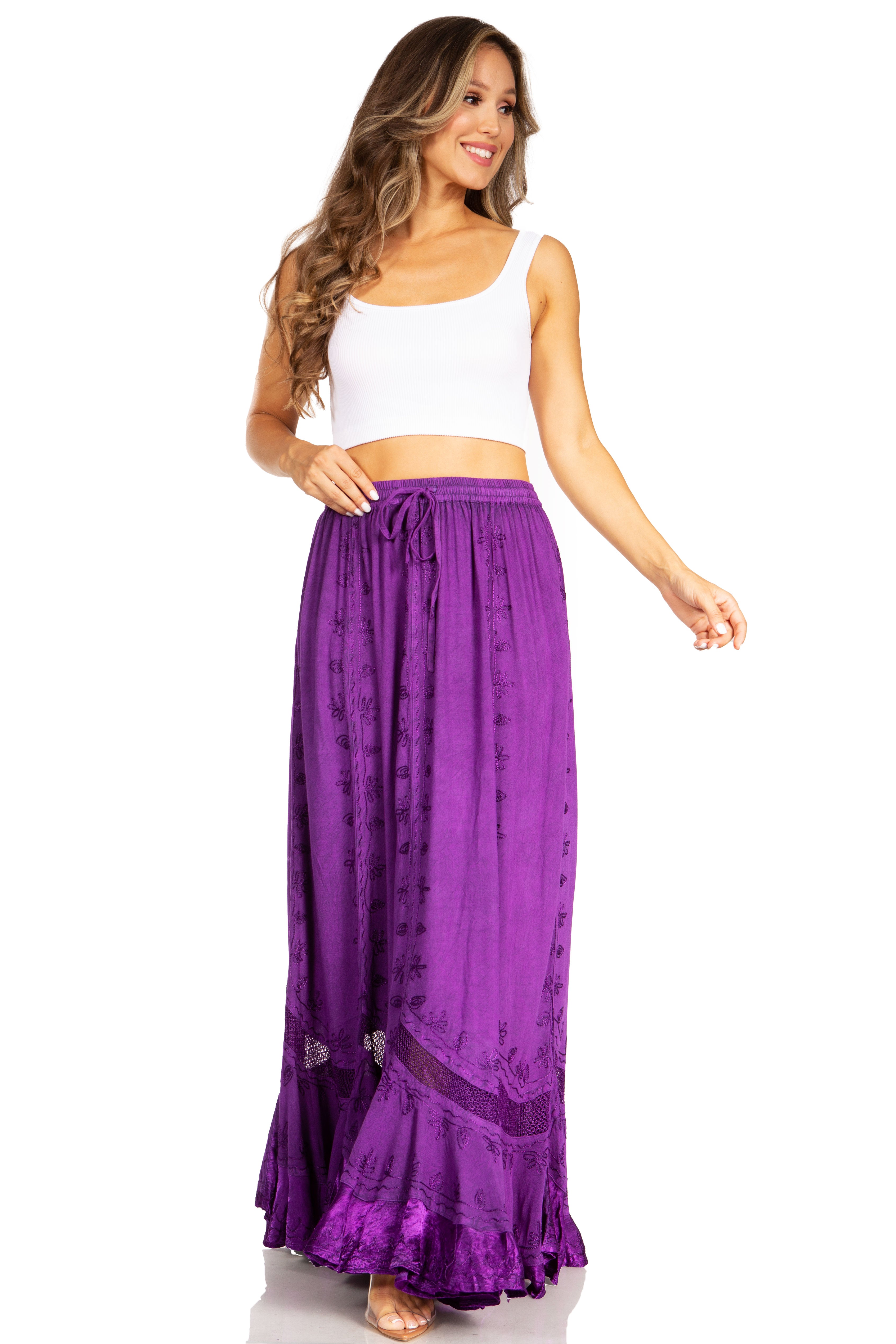 Woman wearing a white top and purple skirt on a white background