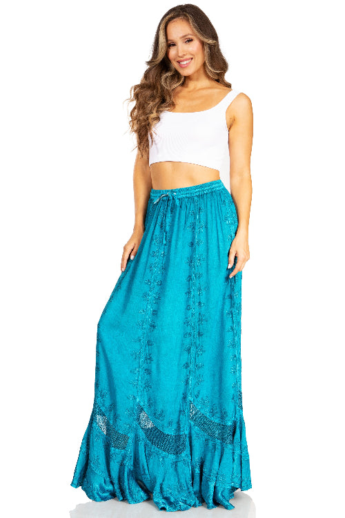 Woman wearing a turquoise skirt and white top on a white background