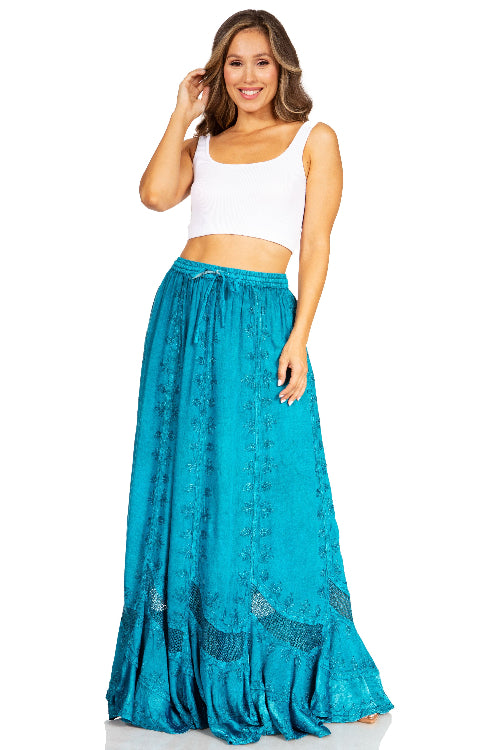 Woman wearing a white top and teal skirt on a white background