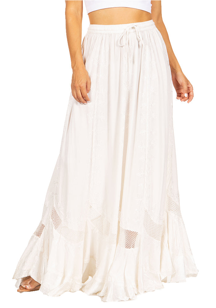 White sheer skirt with mesh panels worn by a person on a white background