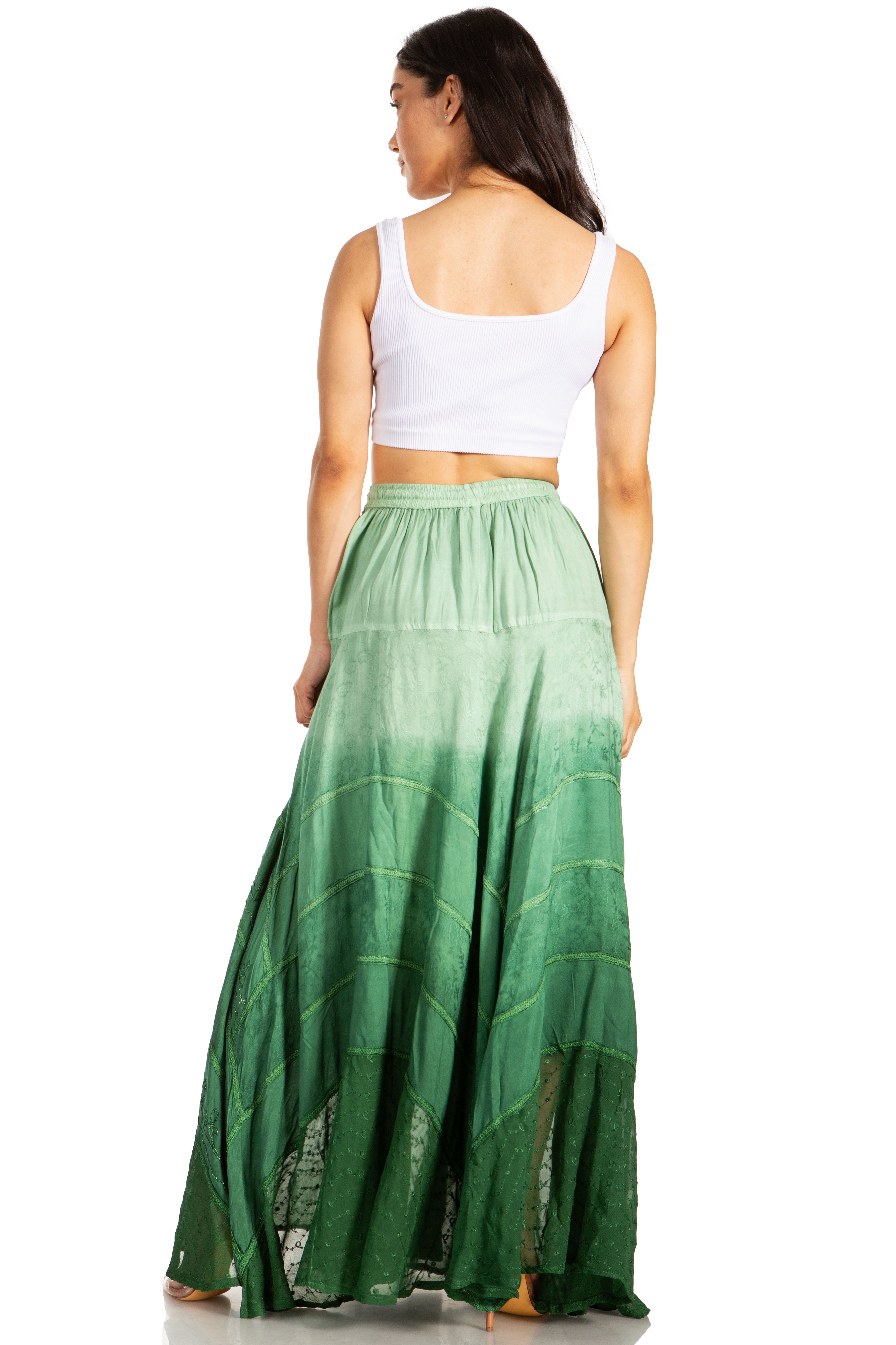 Woman wearing a green ombre skirt on a white background