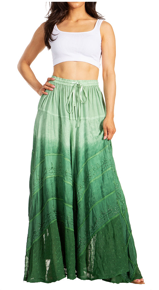Woman wearing a white top and green ombre skirt on a white background