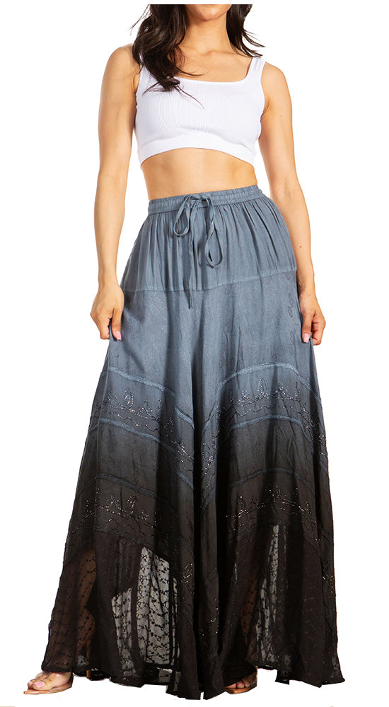 Woman wearing a long, gradient skirt with a white top on a white background