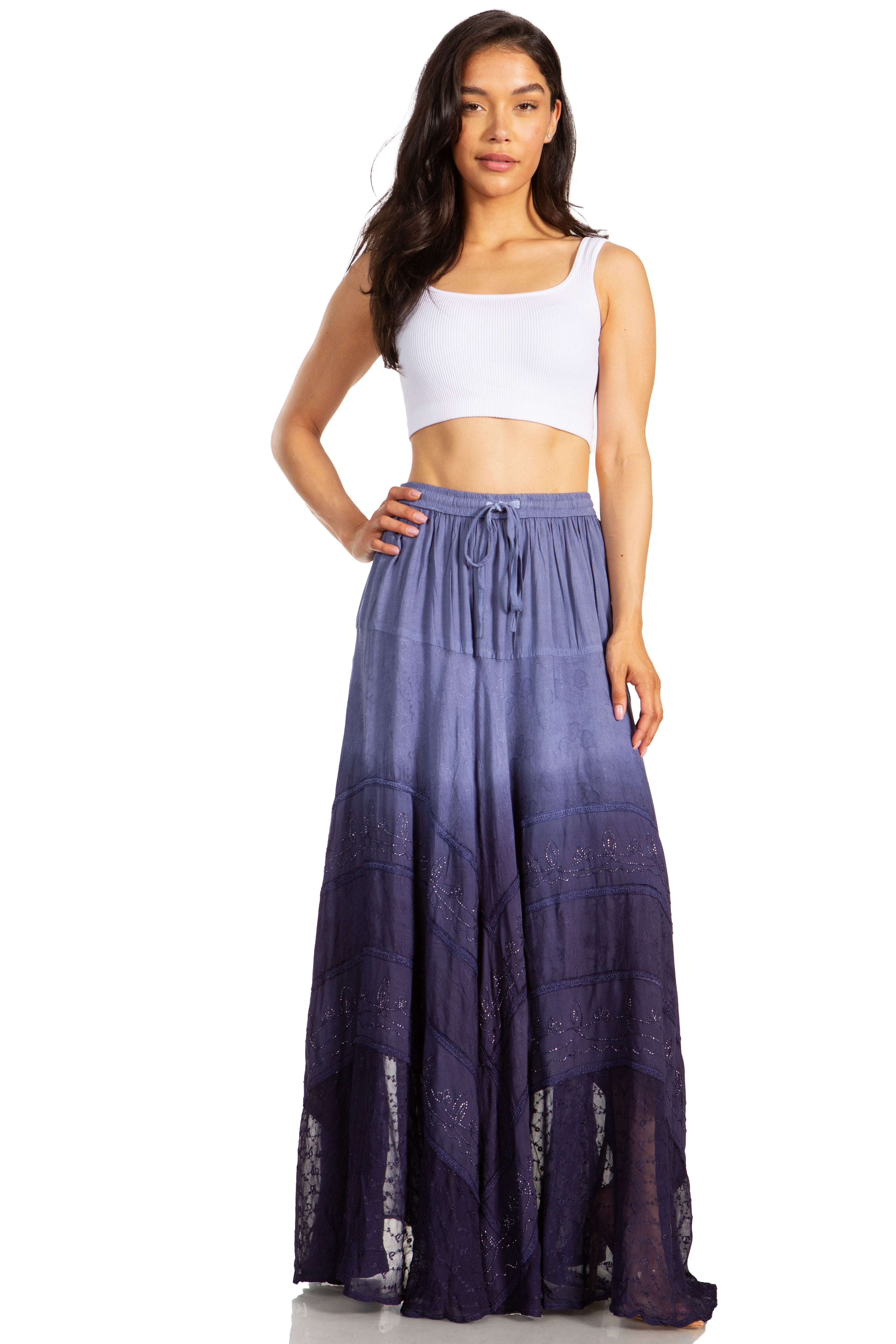 Woman wearing a white top and purple gradient skirt on a white background