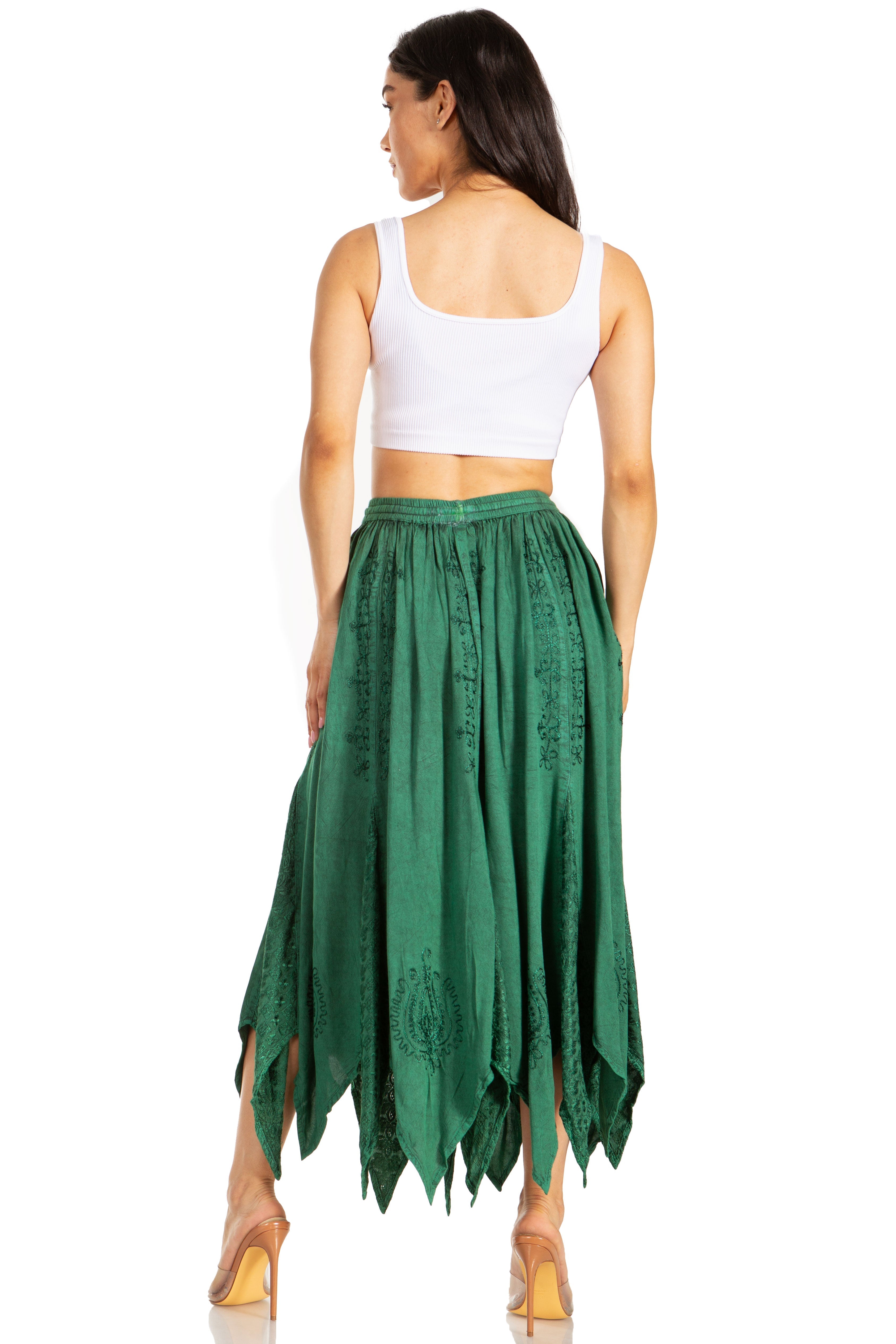 Woman wearing a green skirt and white top on a white background