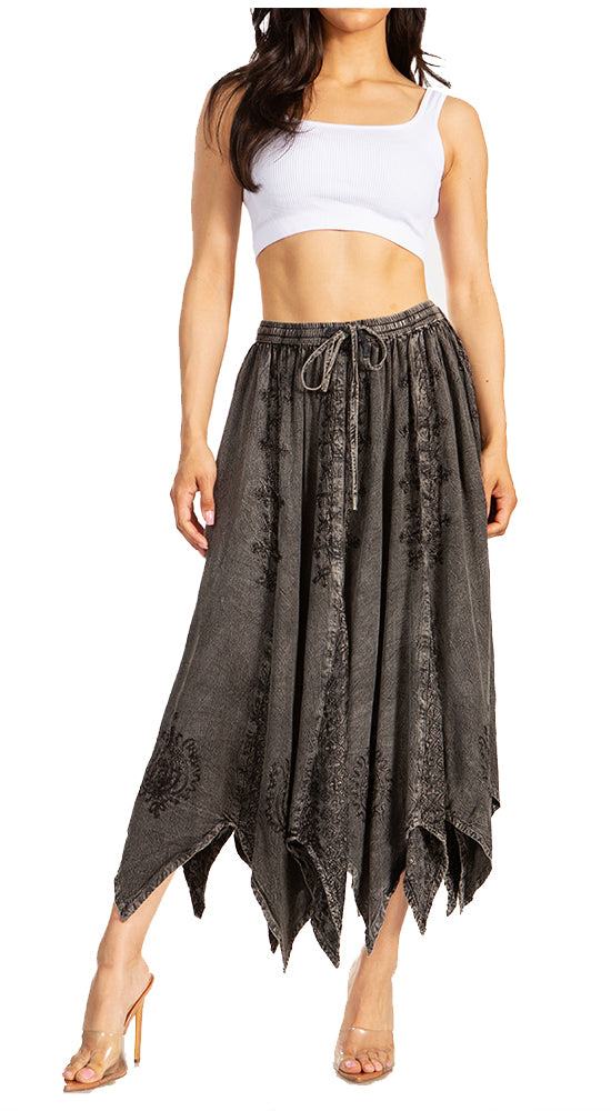 Woman wearing a white crop top and gray lace skirt on a white background