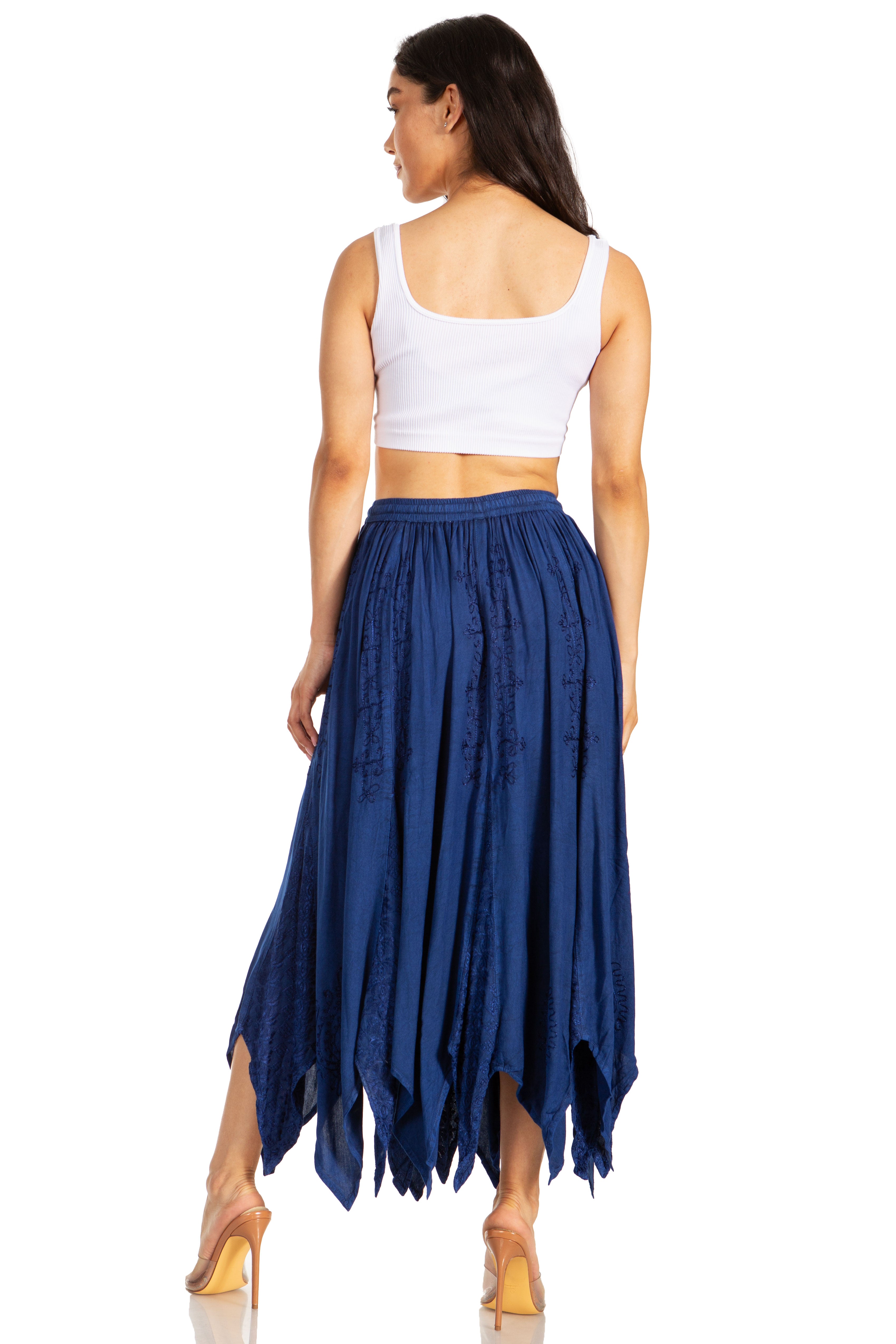 Woman wearing a white top and blue skirt on a white background
