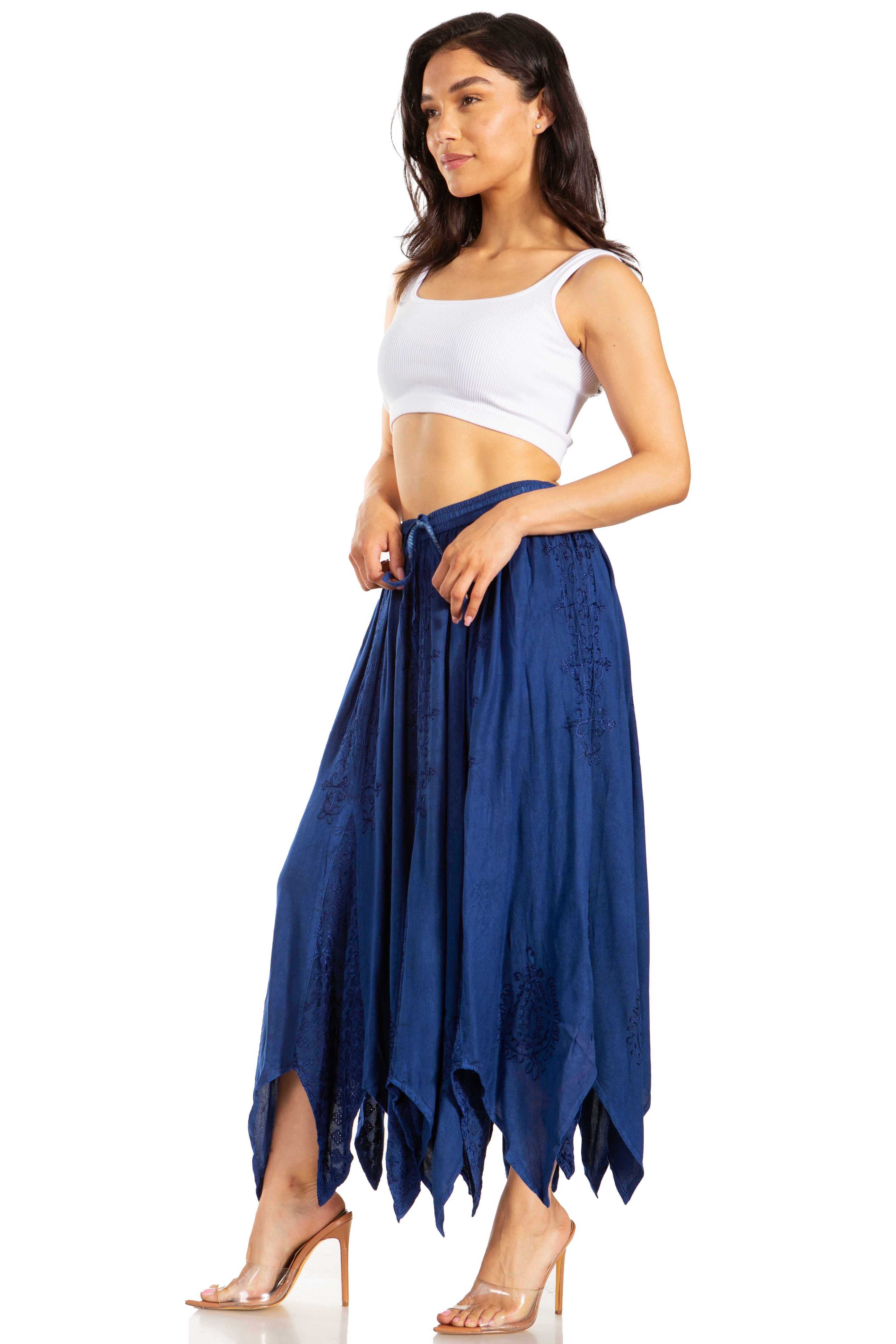 Woman wearing a white top and blue skirt on a white background