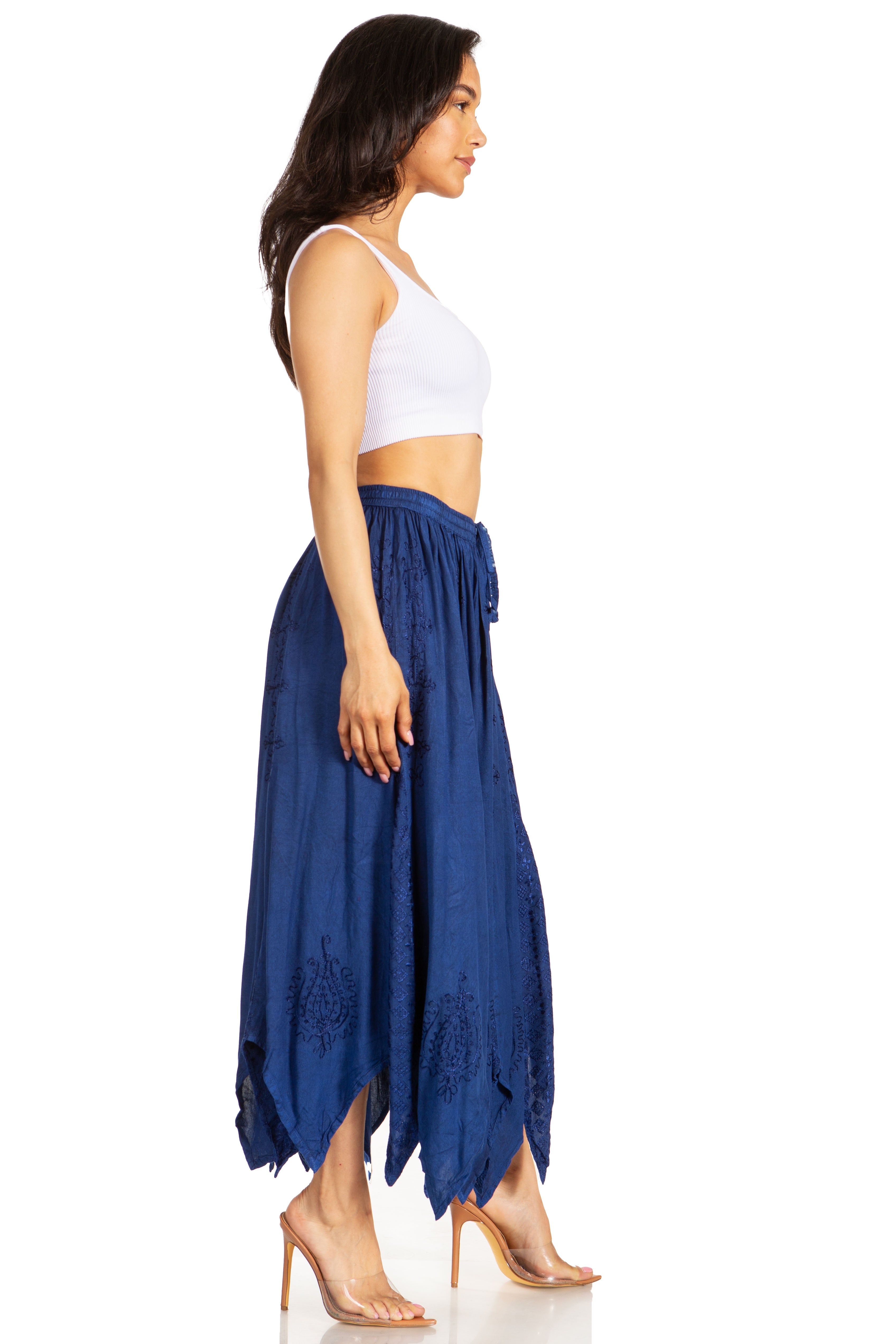 Woman wearing a white top and blue pants on a white background