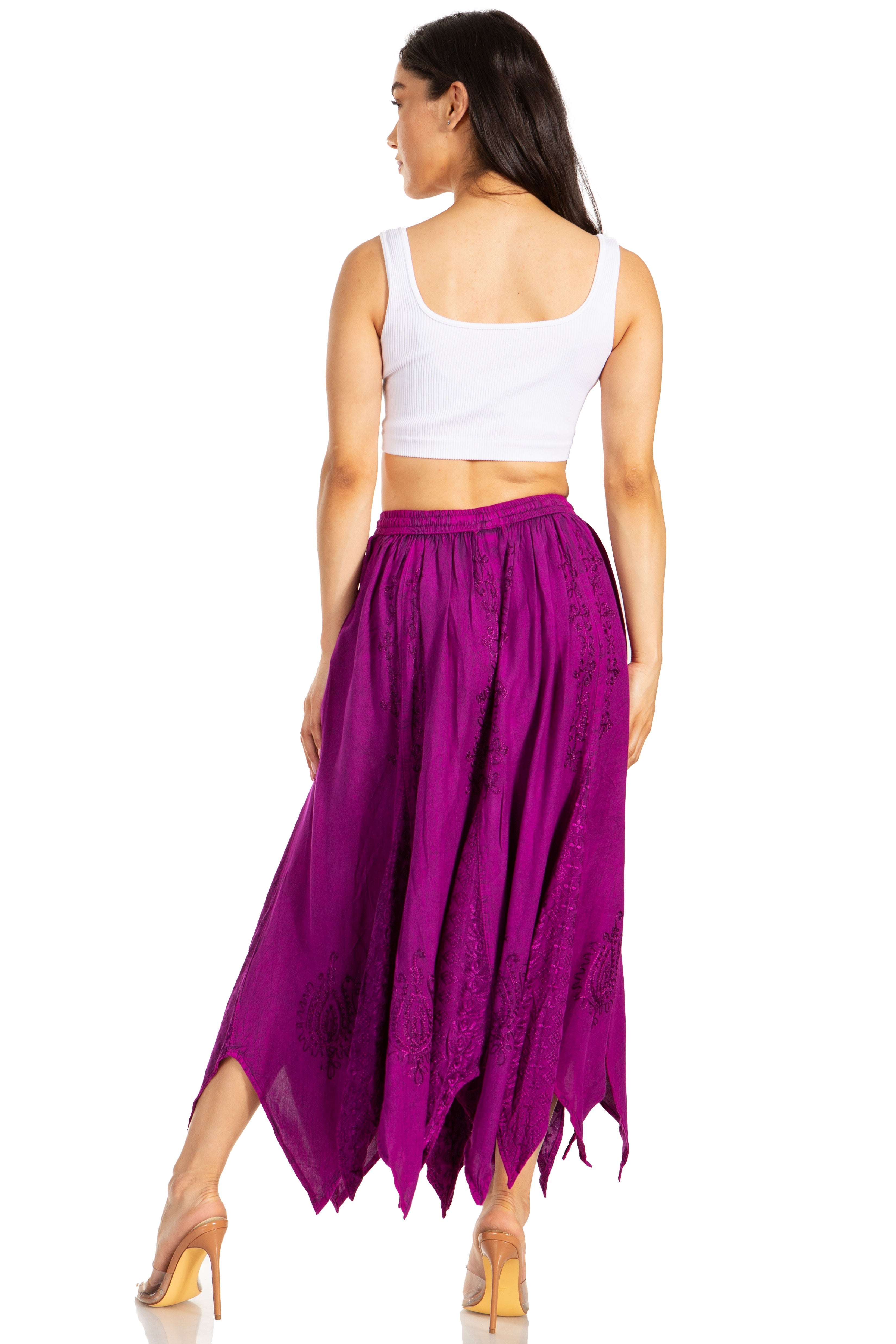 Woman wearing a white top and purple skirt on a white background