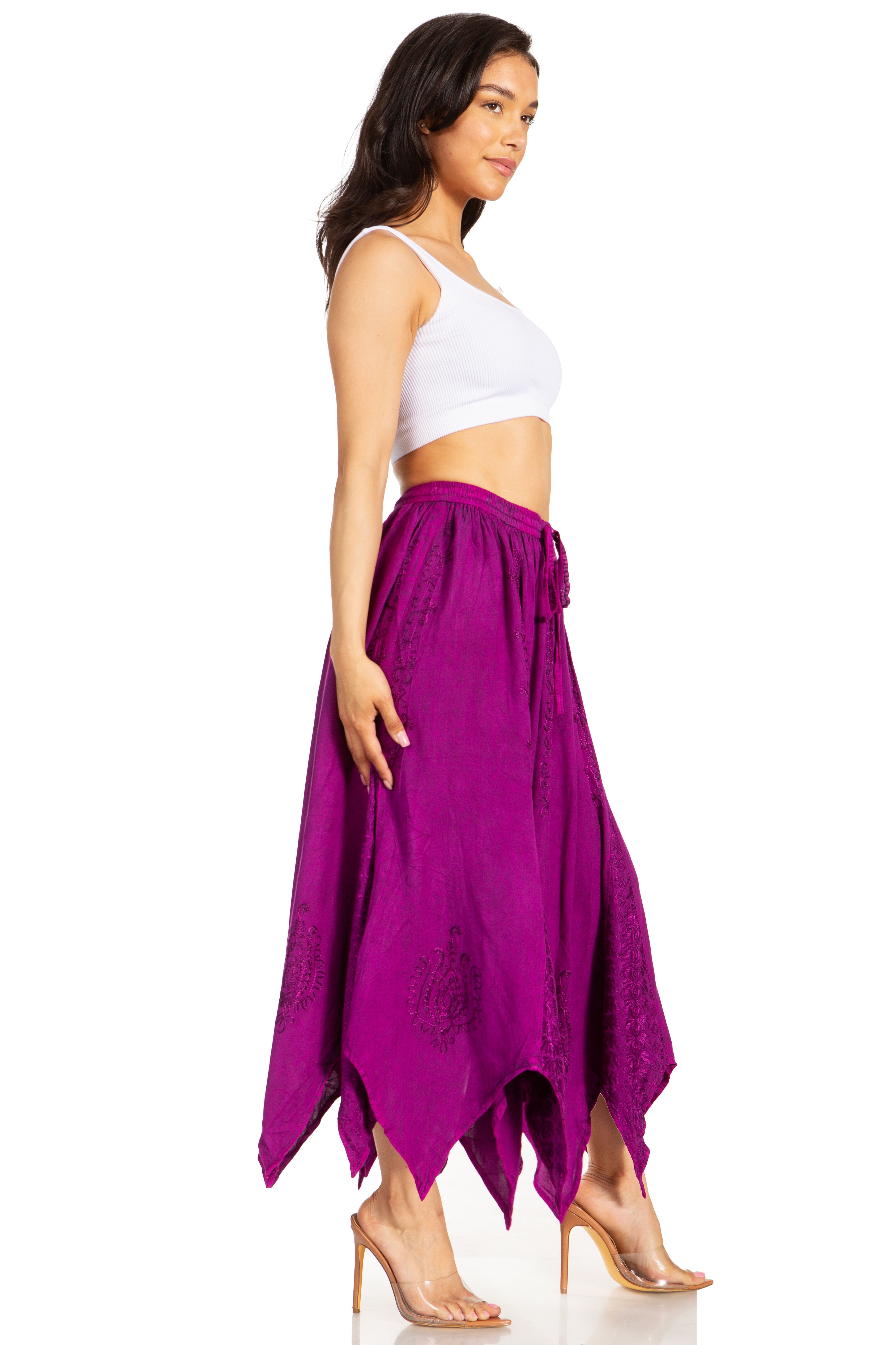 Woman wearing a purple skirt and white top on a white background
